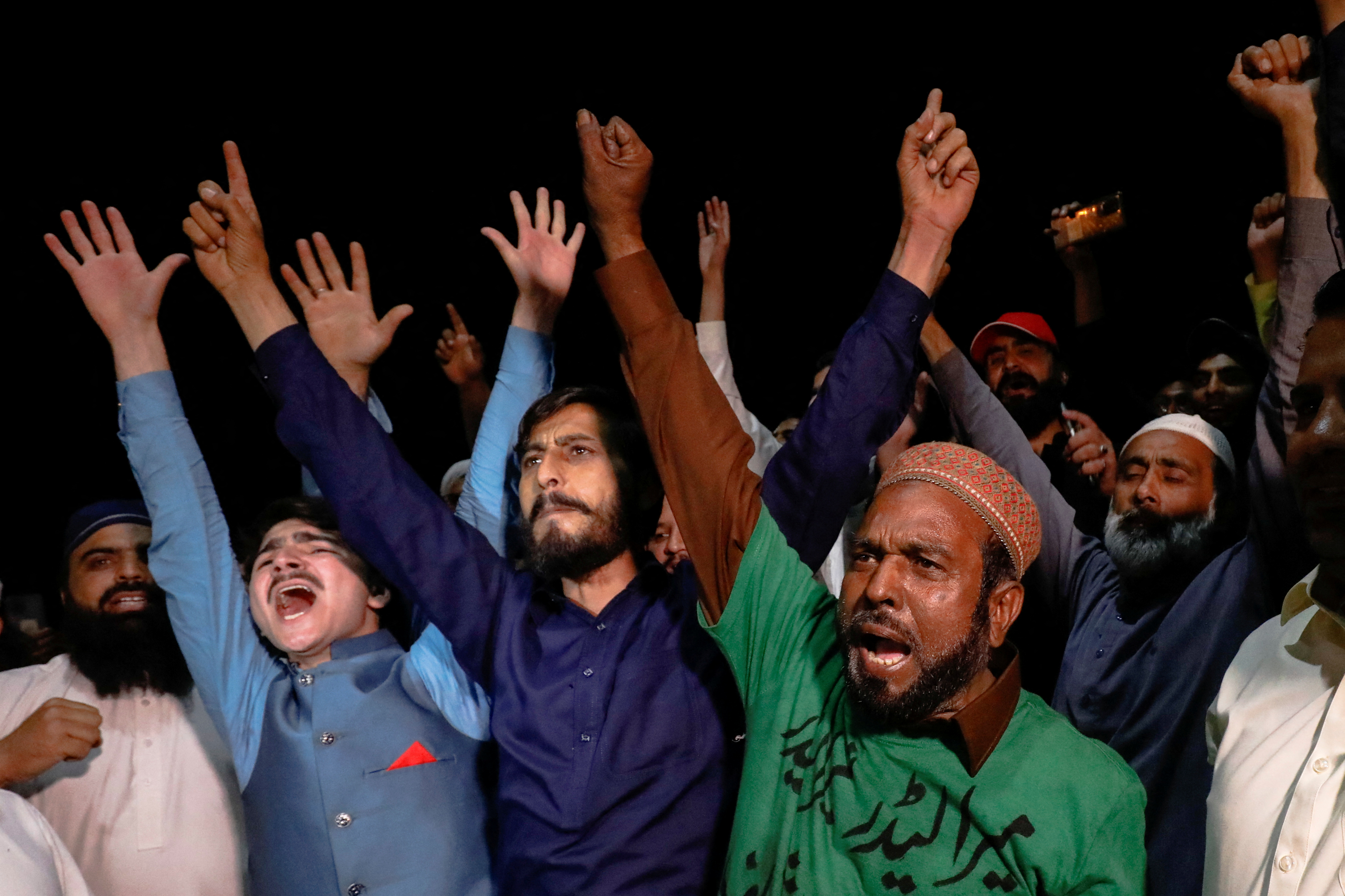 Pakistan Democratic Movement supporters celebrate after former PM Khan lost a confidence vote, in Islamabad