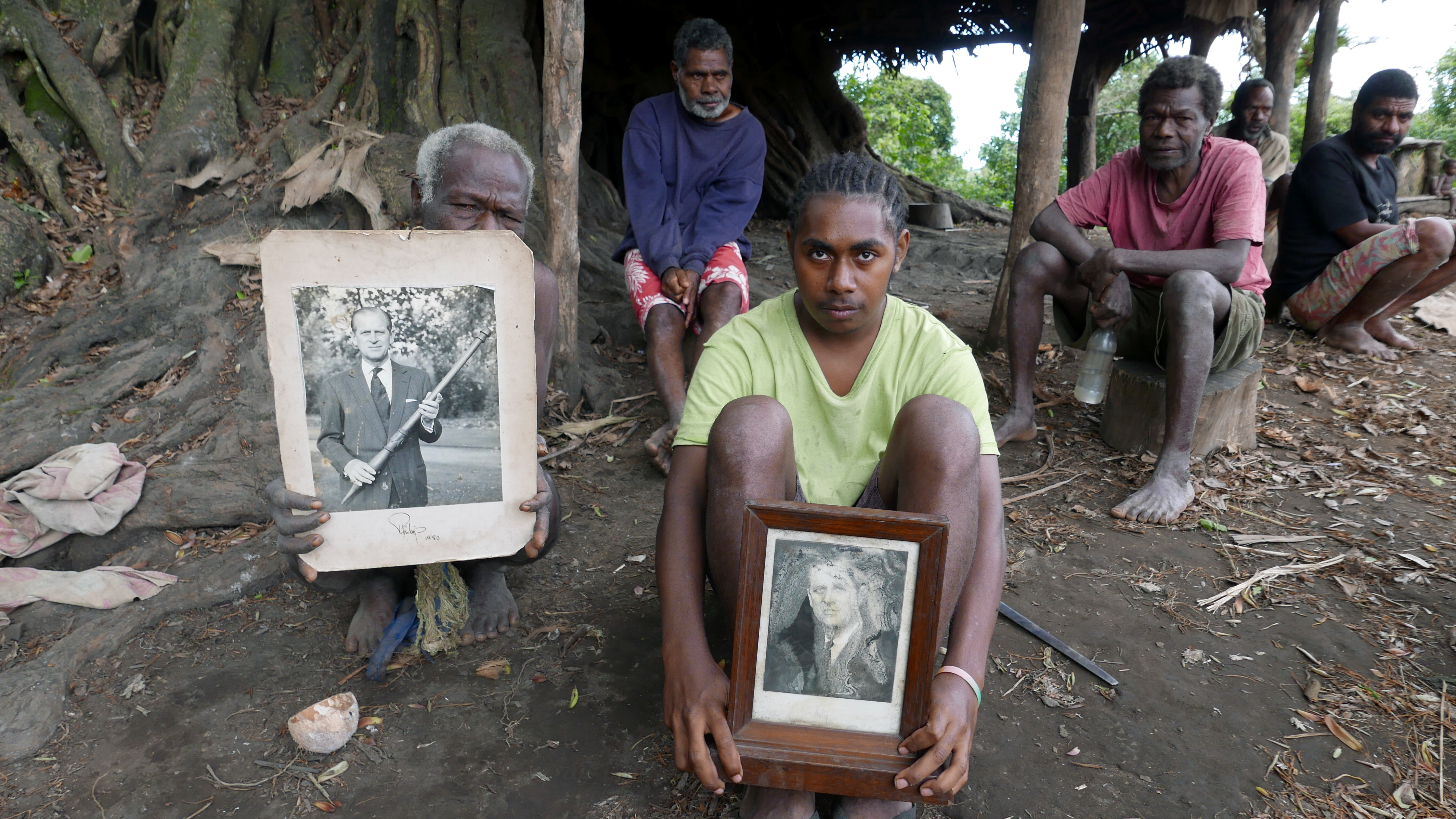 Tanna locals hold pictures of Prince Philip
