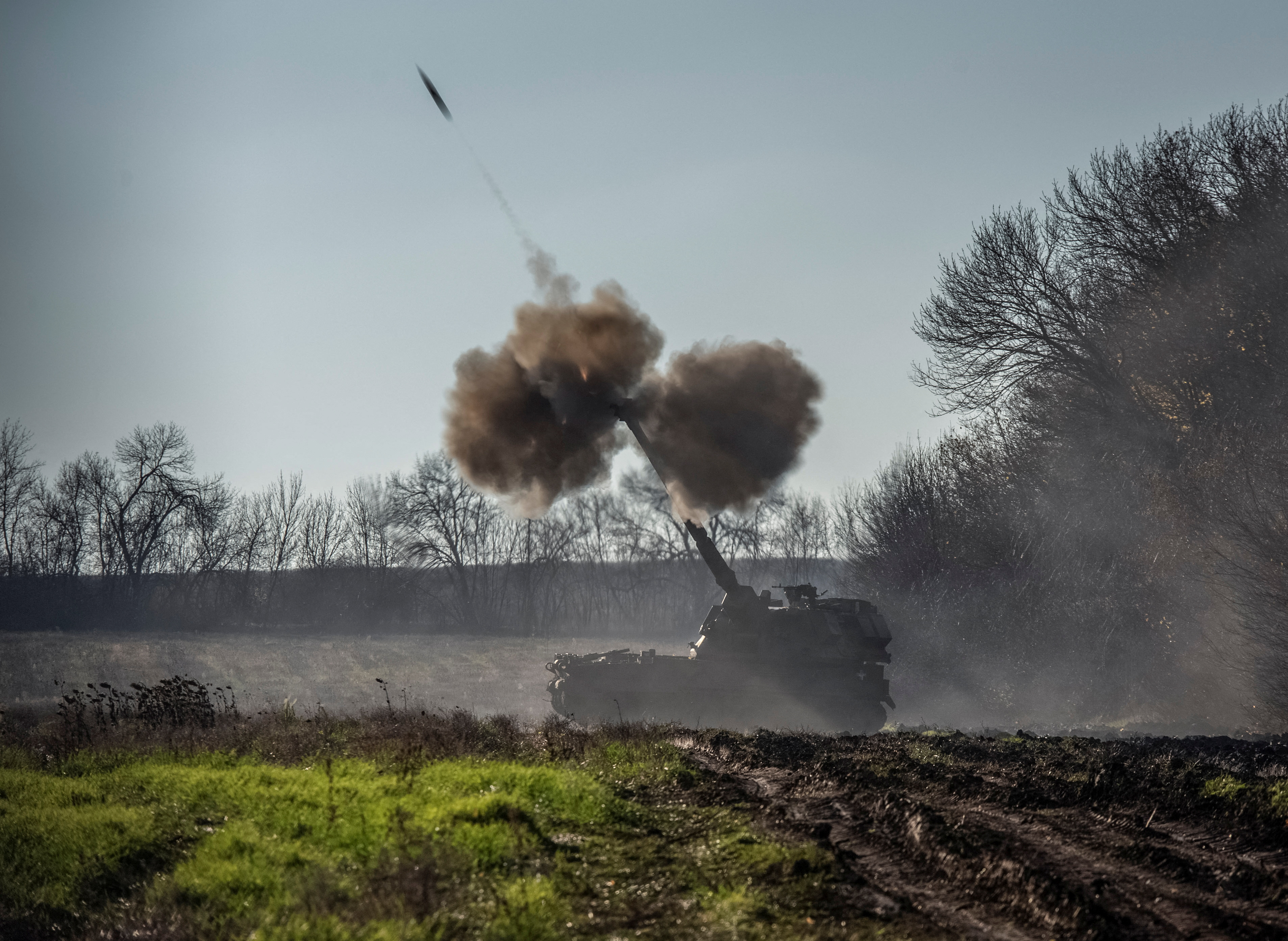 Ukrainian servicemen fire a Polish self-propelled howitzer Krab toward Russian positions in Donetsk region