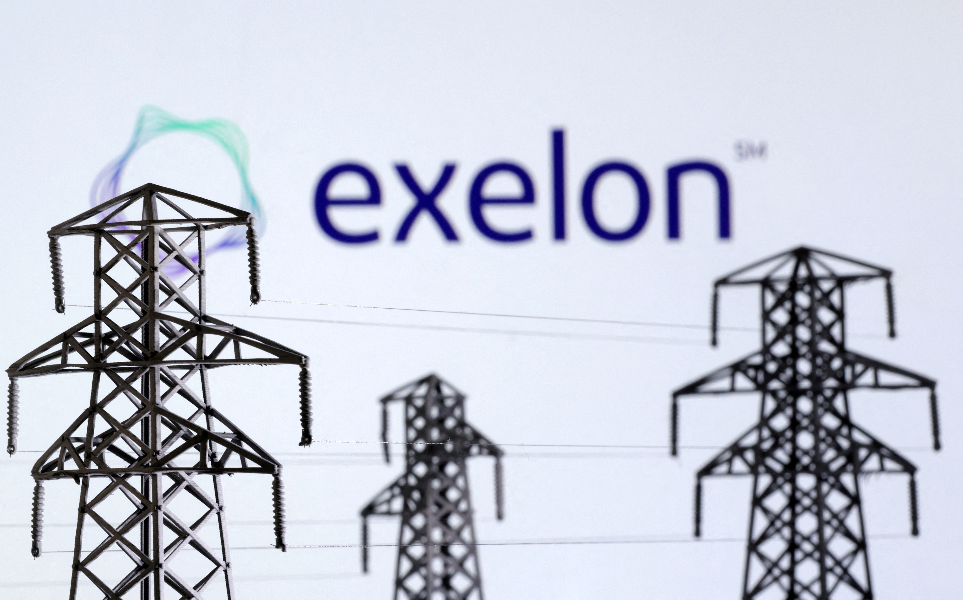 Illustration shows Electric power transmission pylon miniatures and Exelon Corporation logo