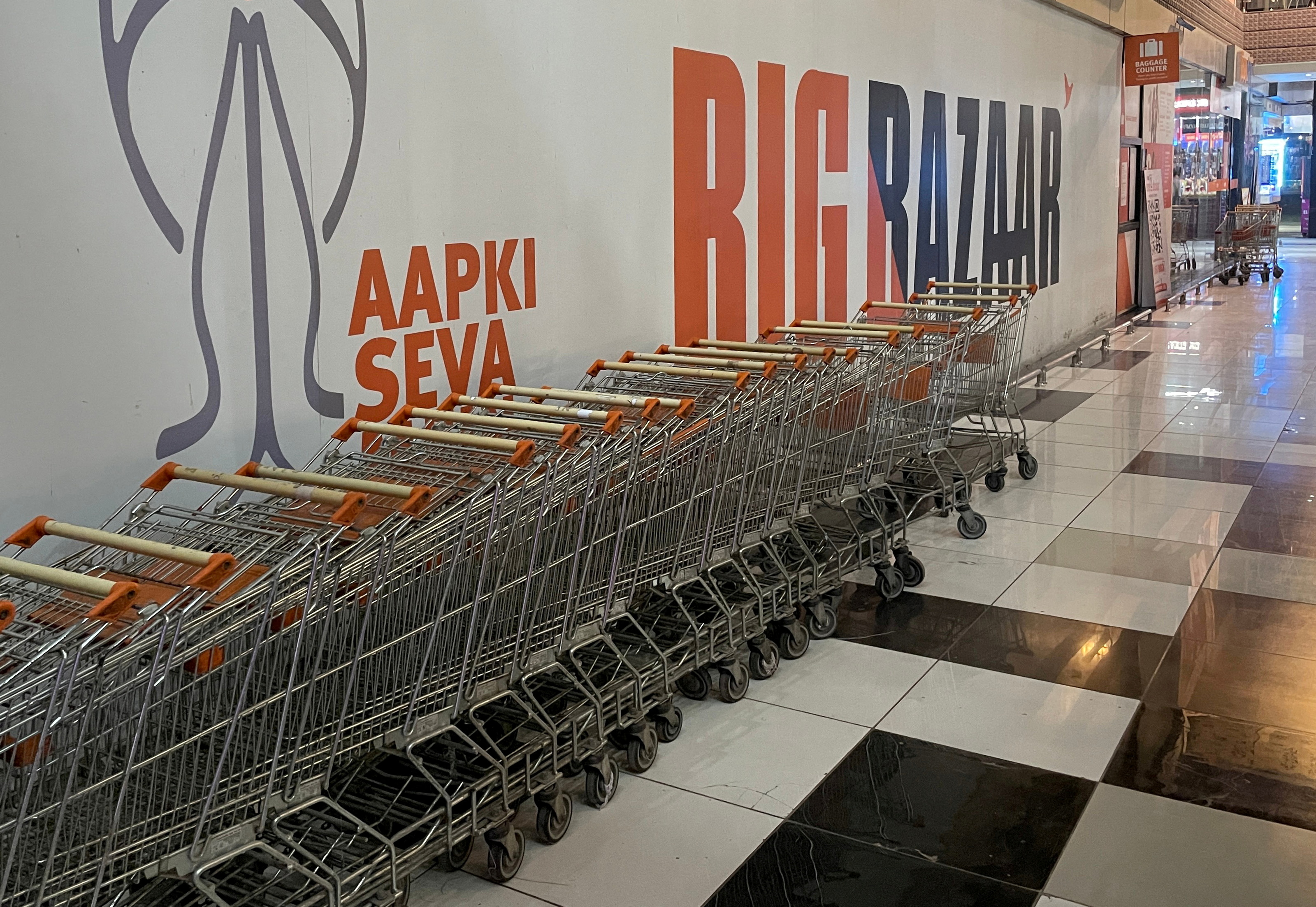 Shopping trolleys are parked outside a closed Big Bazaar retail store on the outskirts of Ahmedabad