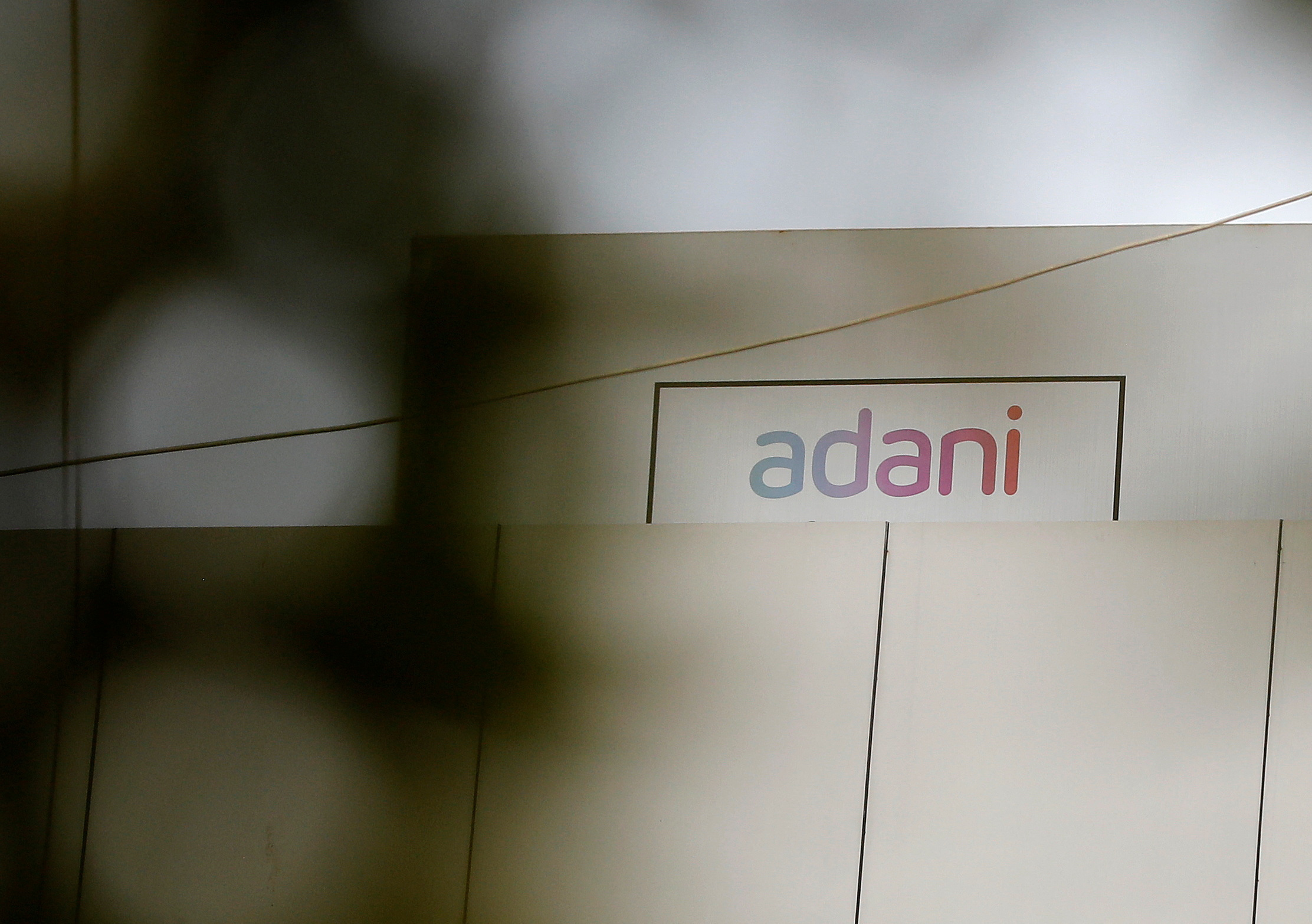 The logo of the Adani Group is seen on one of its buildings in Ahmedabad