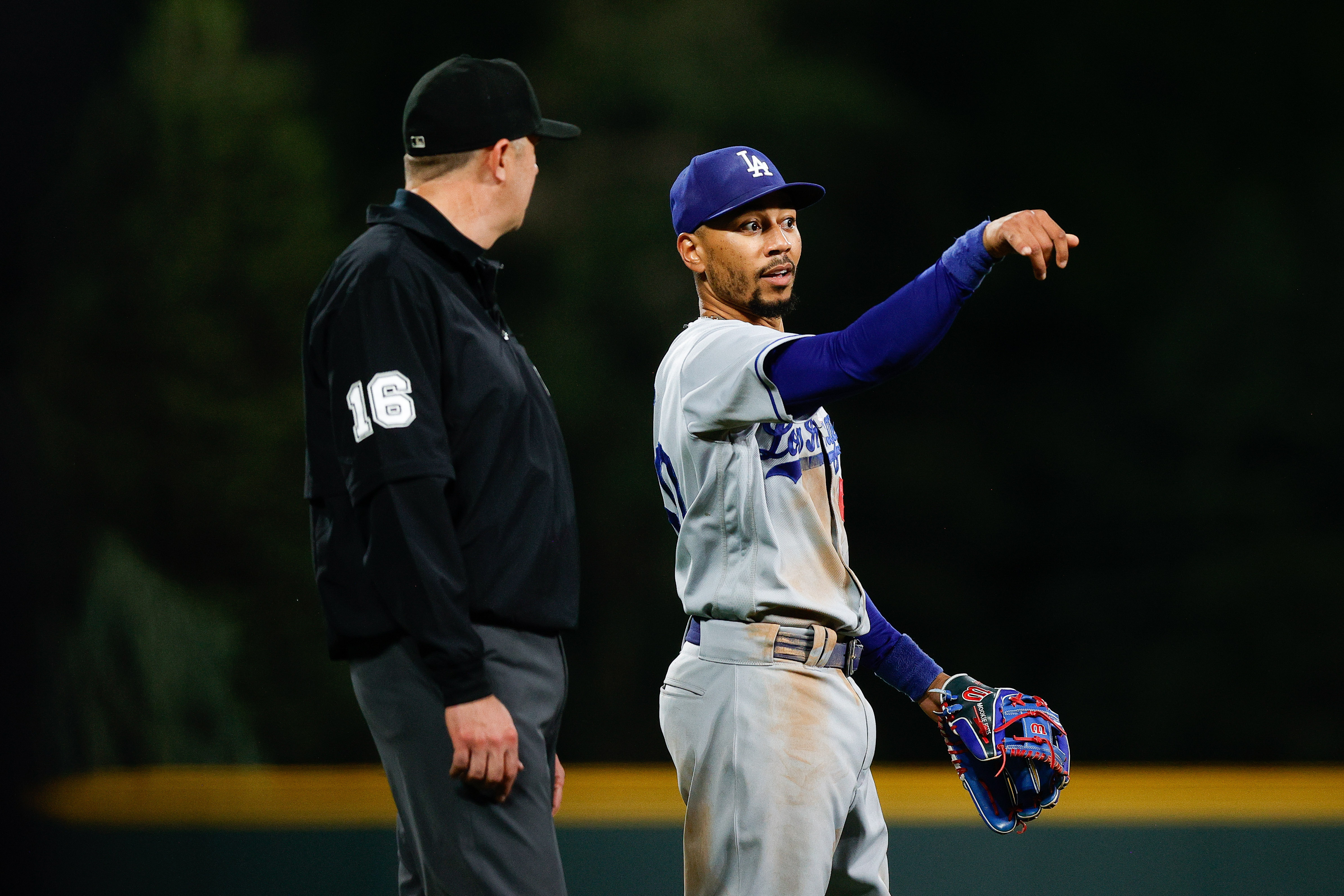 Martinez helps power Dodgers past Rockies 14-3 after a severe weather delay