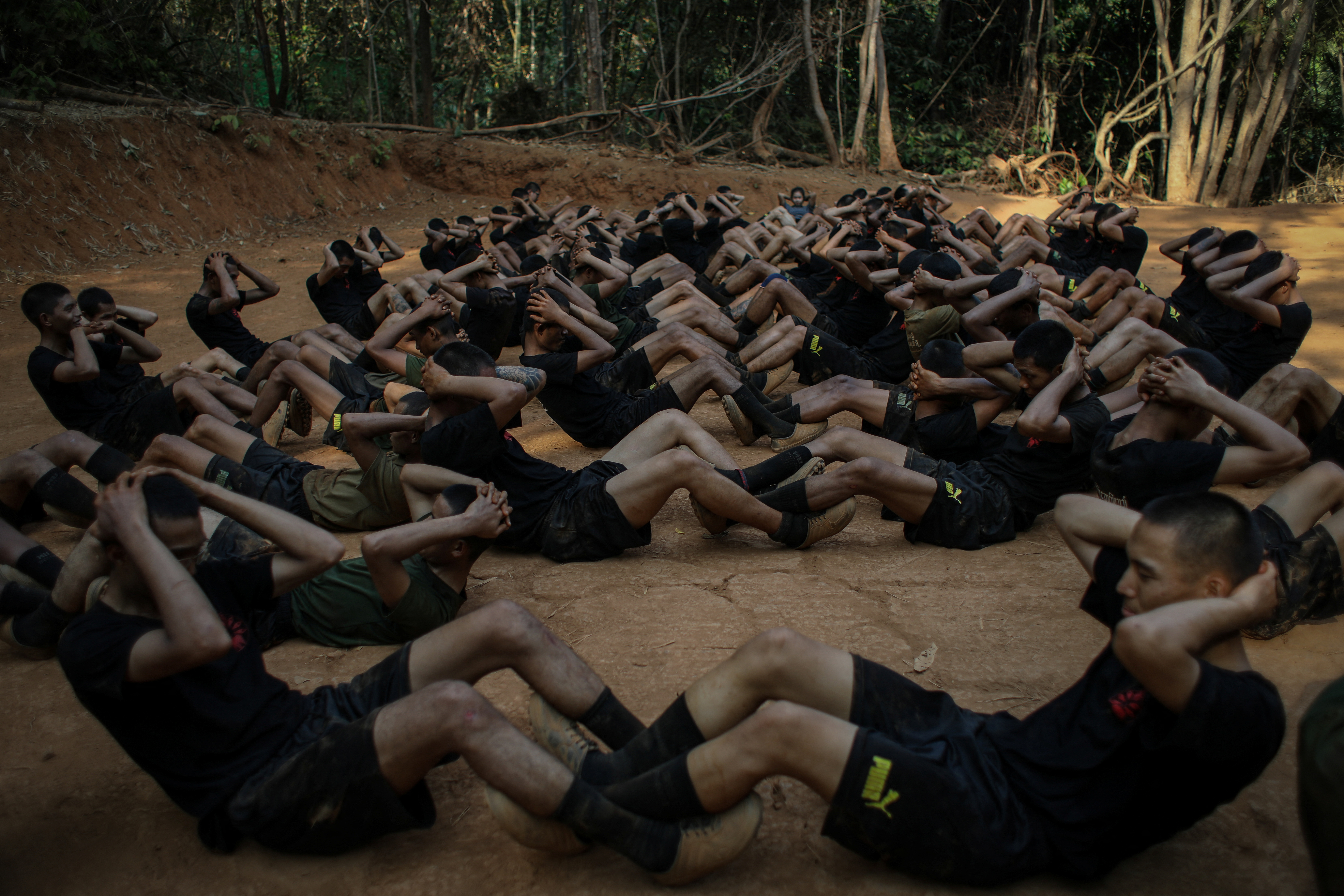 The Wider Image: In Myanmar's jungles, young volunteers train hard to fight junta