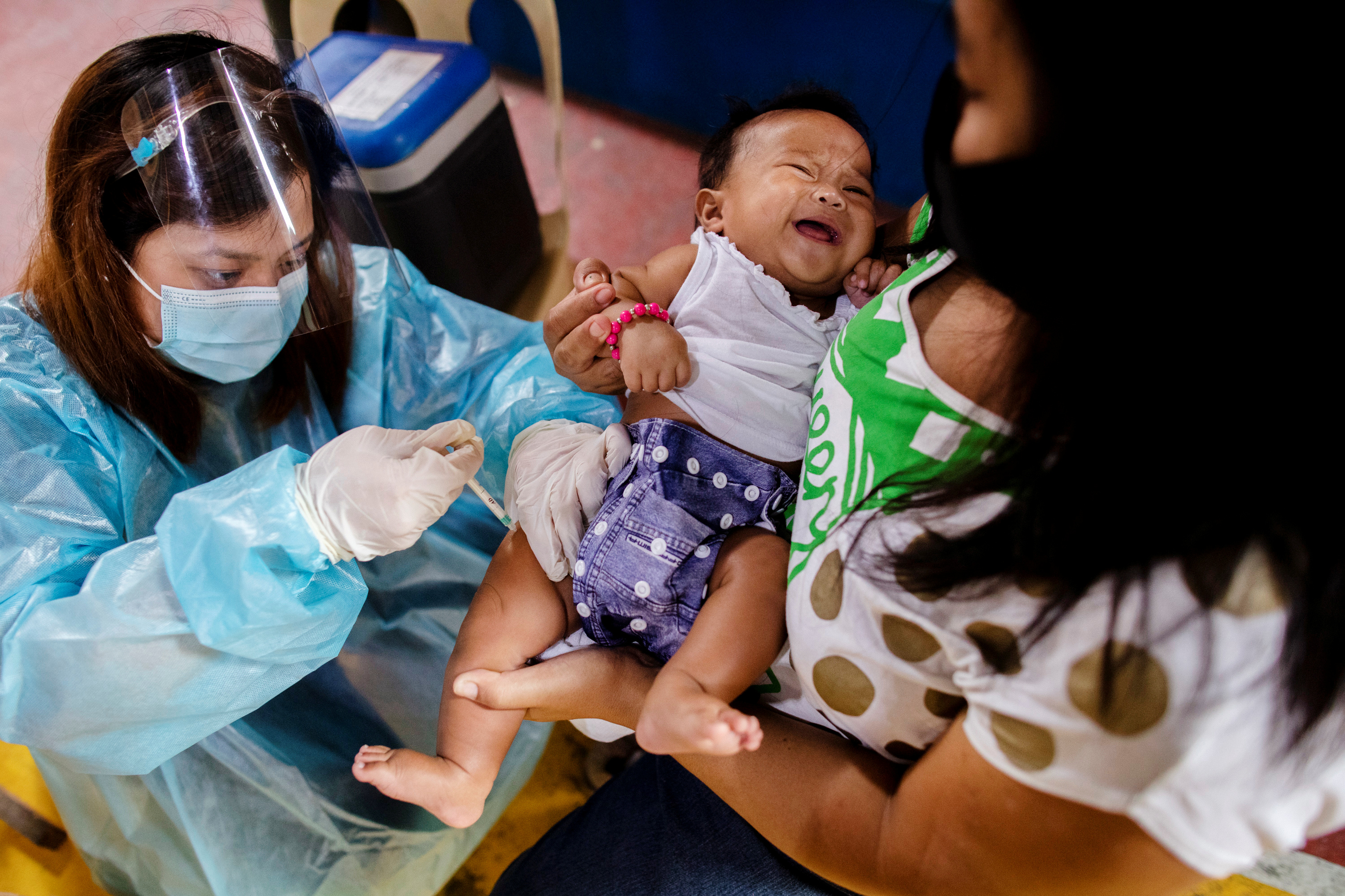 Ghosts of past vaccine deaths haunt Philippines' COVID-19 drive