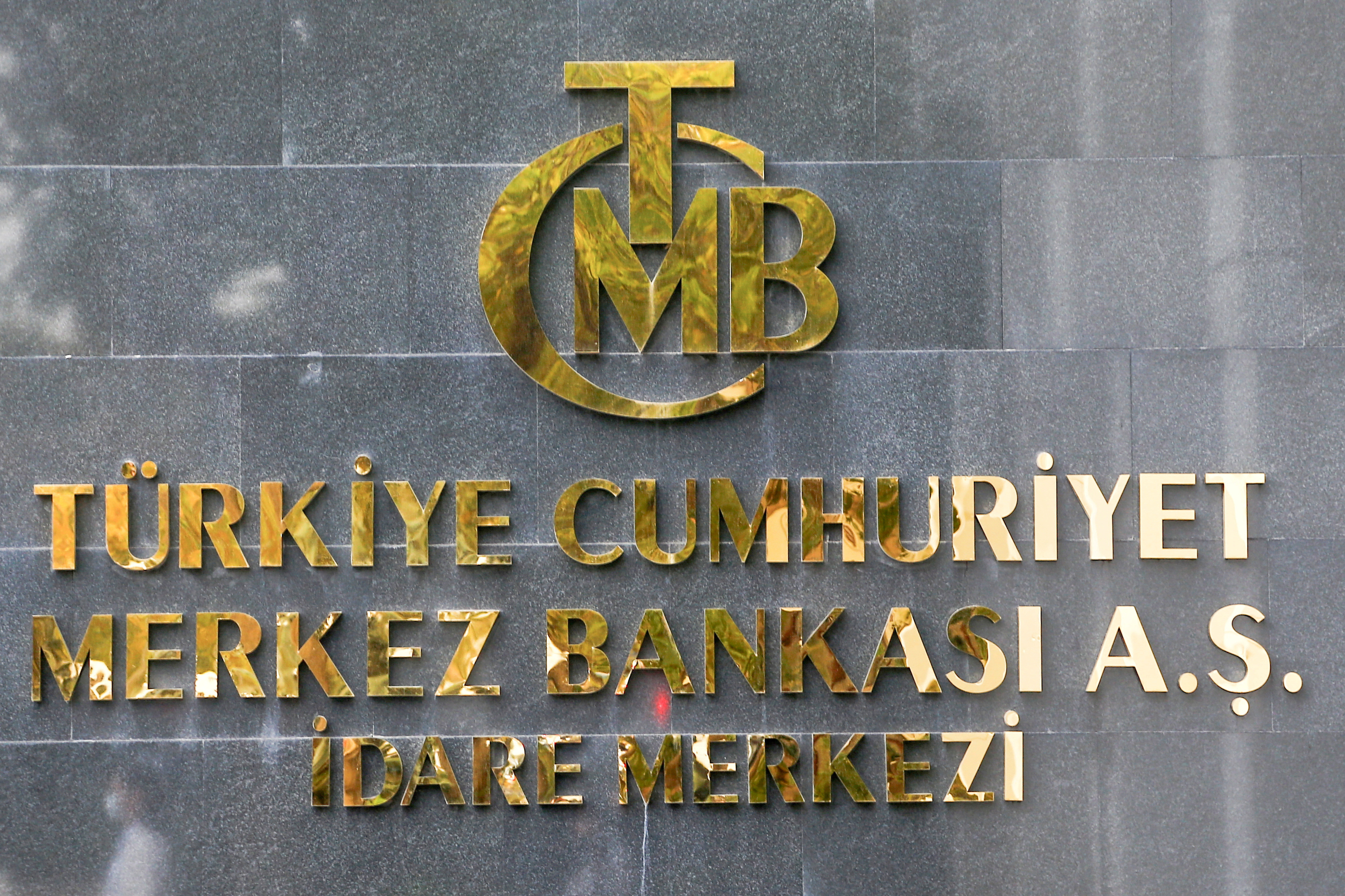 A logo of Turkey's Central Bank is pictured at the entrance of its headquarters in Ankara