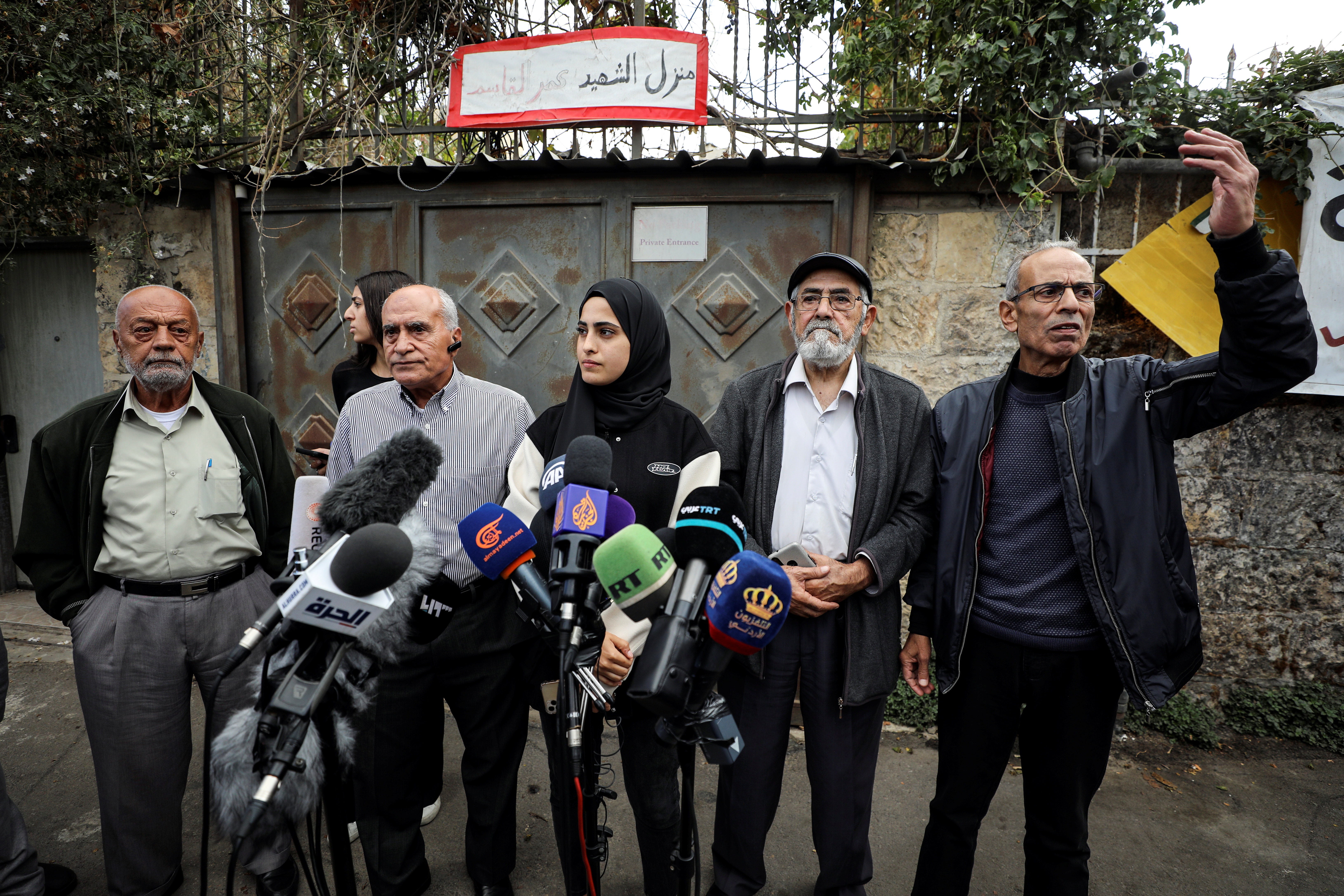 Palestinian activist Muna El-Kurd stands with her family members at a media conference in the East Jerusalem neighbourhood of Sheikh Jarrah November 2, 2021. REUTERS/Ammar Awad