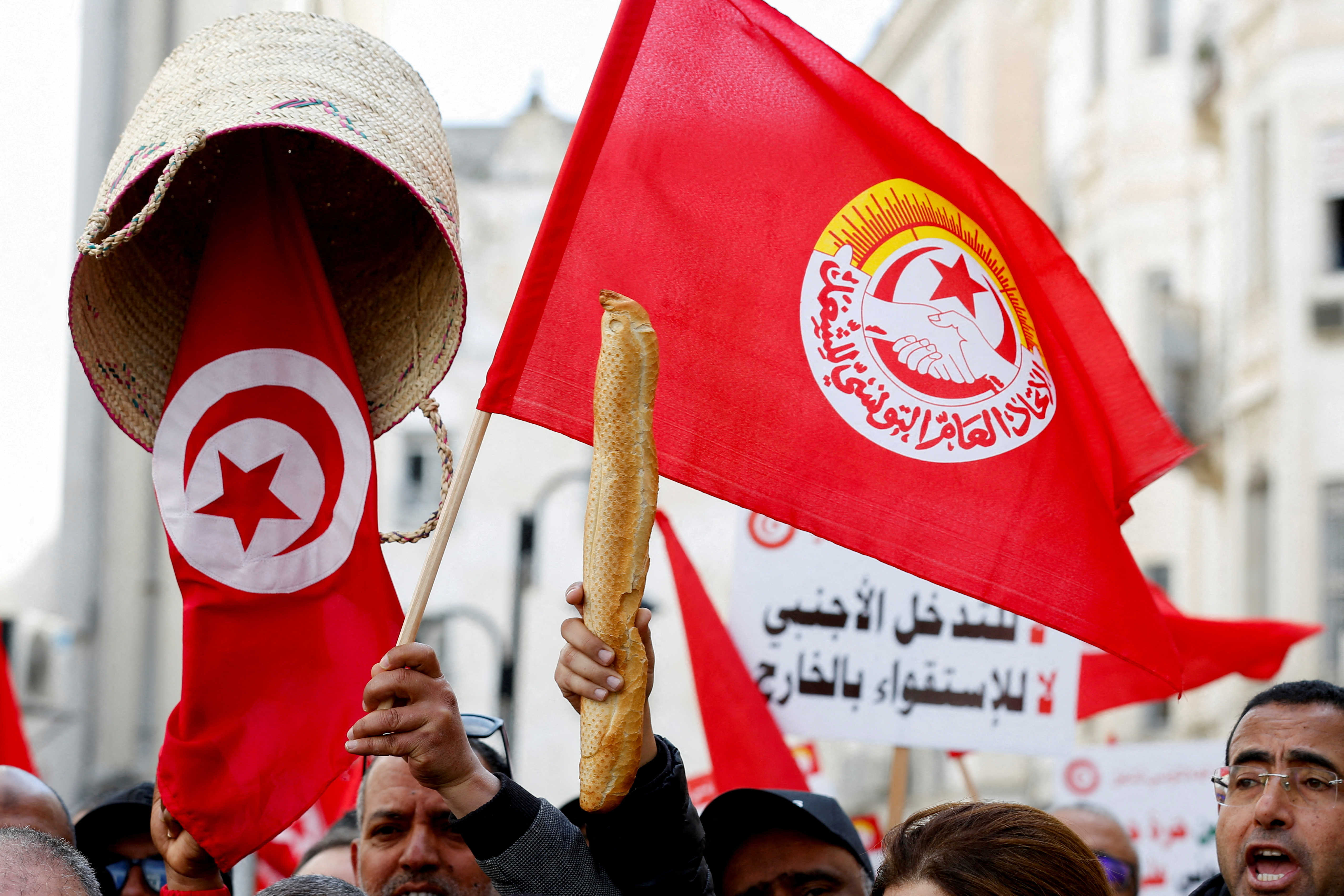 Supporters of the Tunisian General Labour Union (UGTT) protest in Tunis