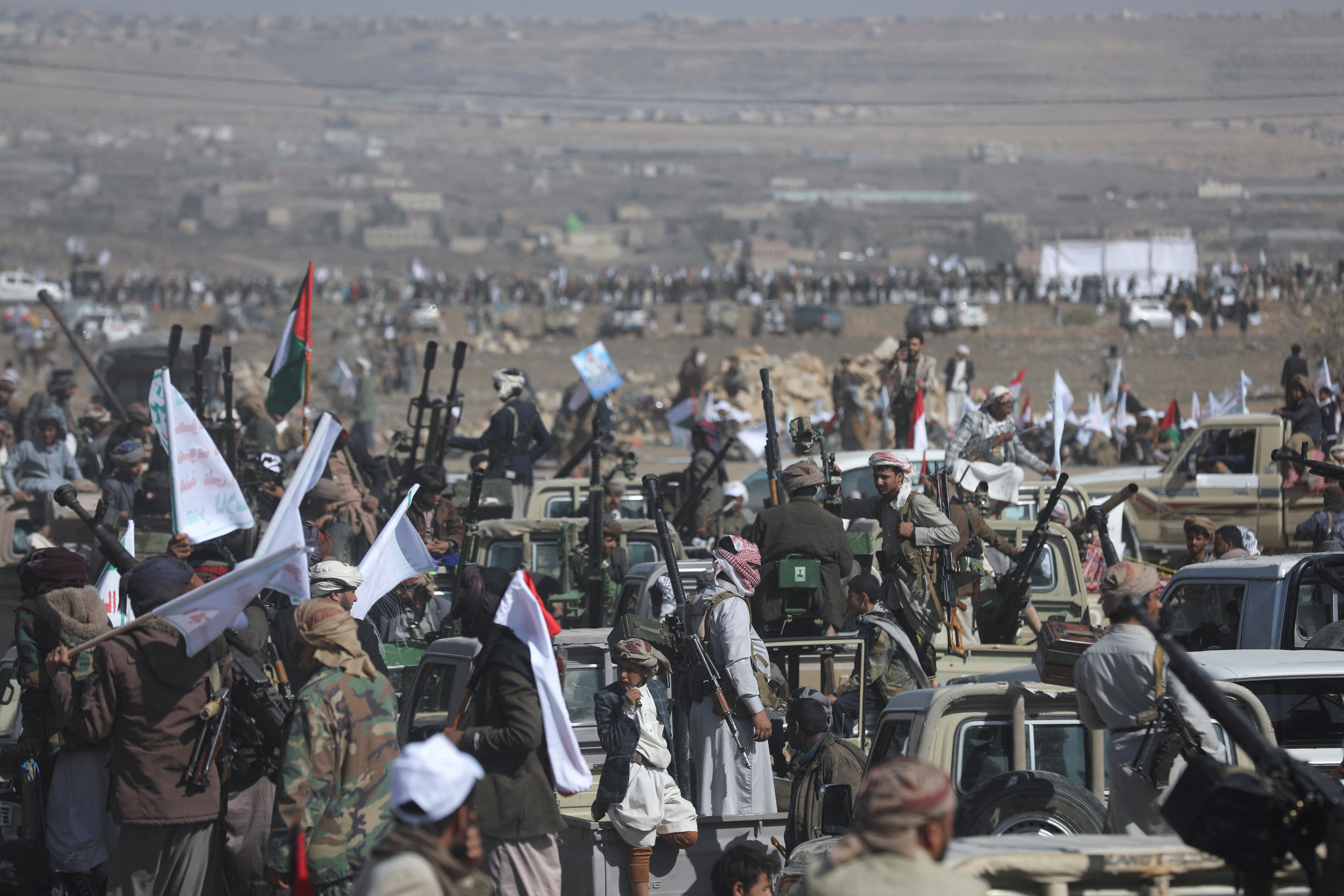 Houthi tribesmen parade to show defiance after U.S. and U.K. air strikes on Houthi positions near Sanaa