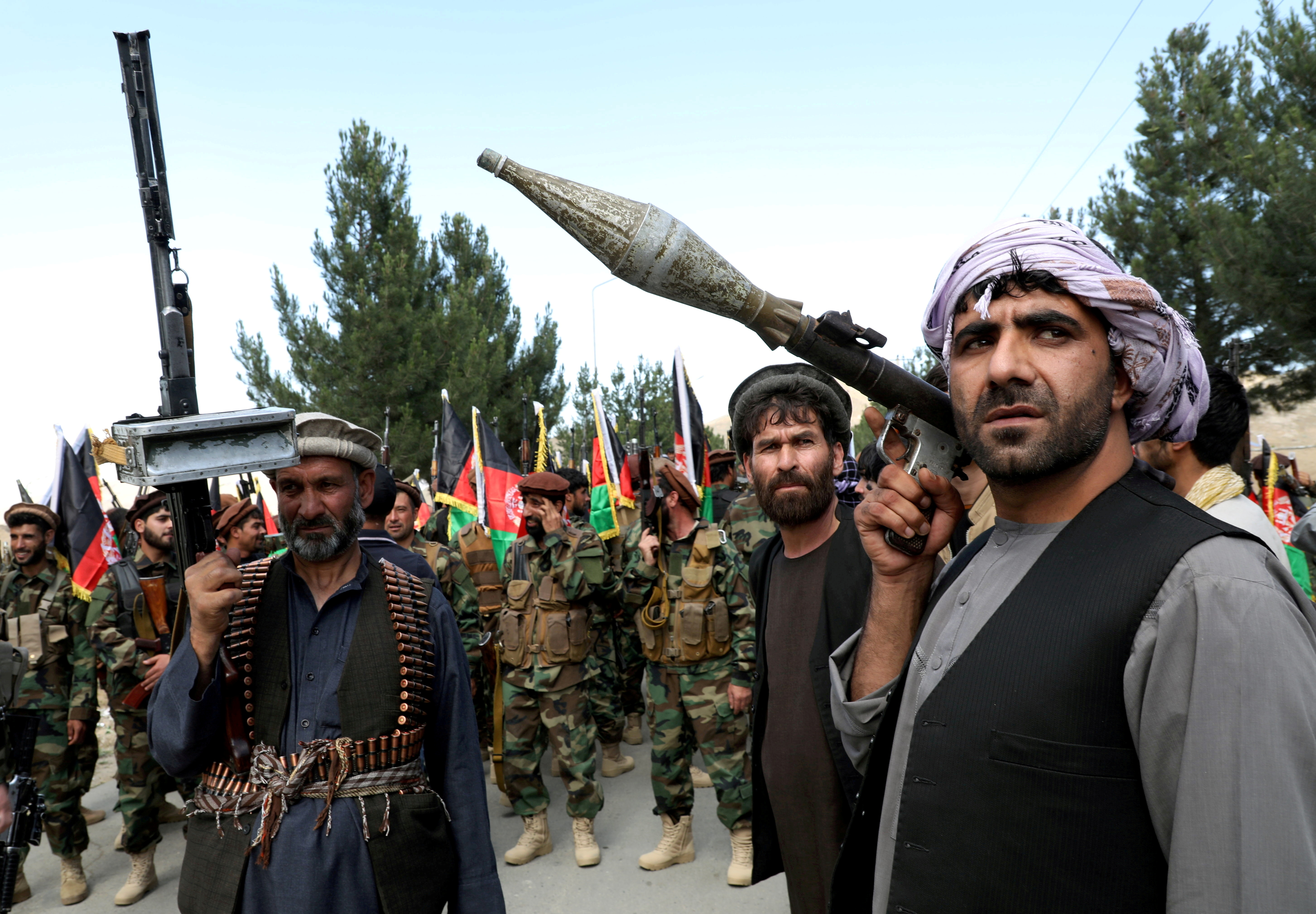 Hundreds of armed men gather to announce their support for Afghan security forces on the outskirts of Kabul