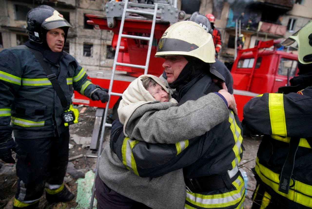 Rescuers work to get people out of residential building that was struck in Kyiv