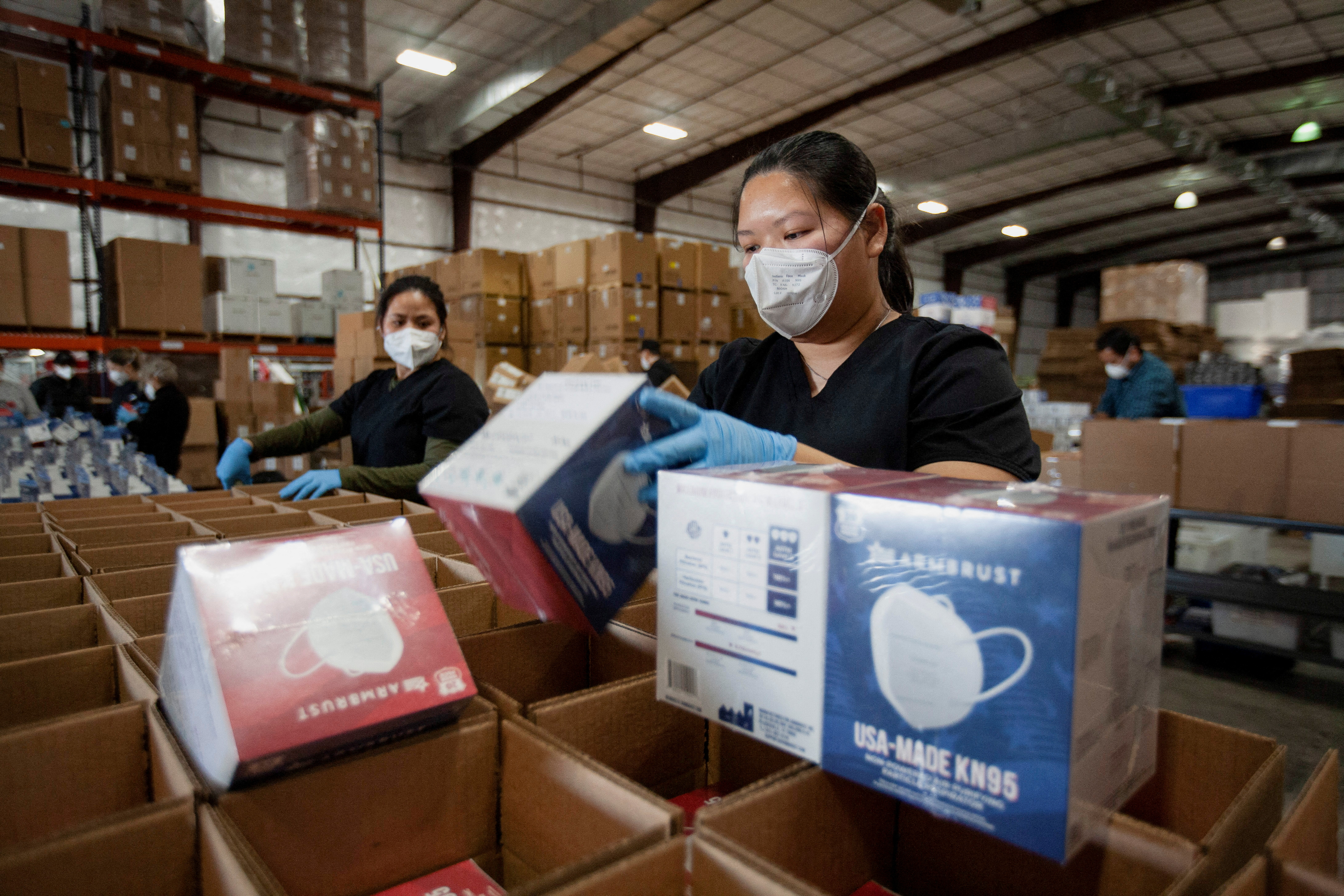 Sue Nguyen, an operator for Armbrust American, packs masks at the company's warehouse in Pflugerville, Texas, U.S., January 12, 2022. REUTERS/Nuri Vallbona