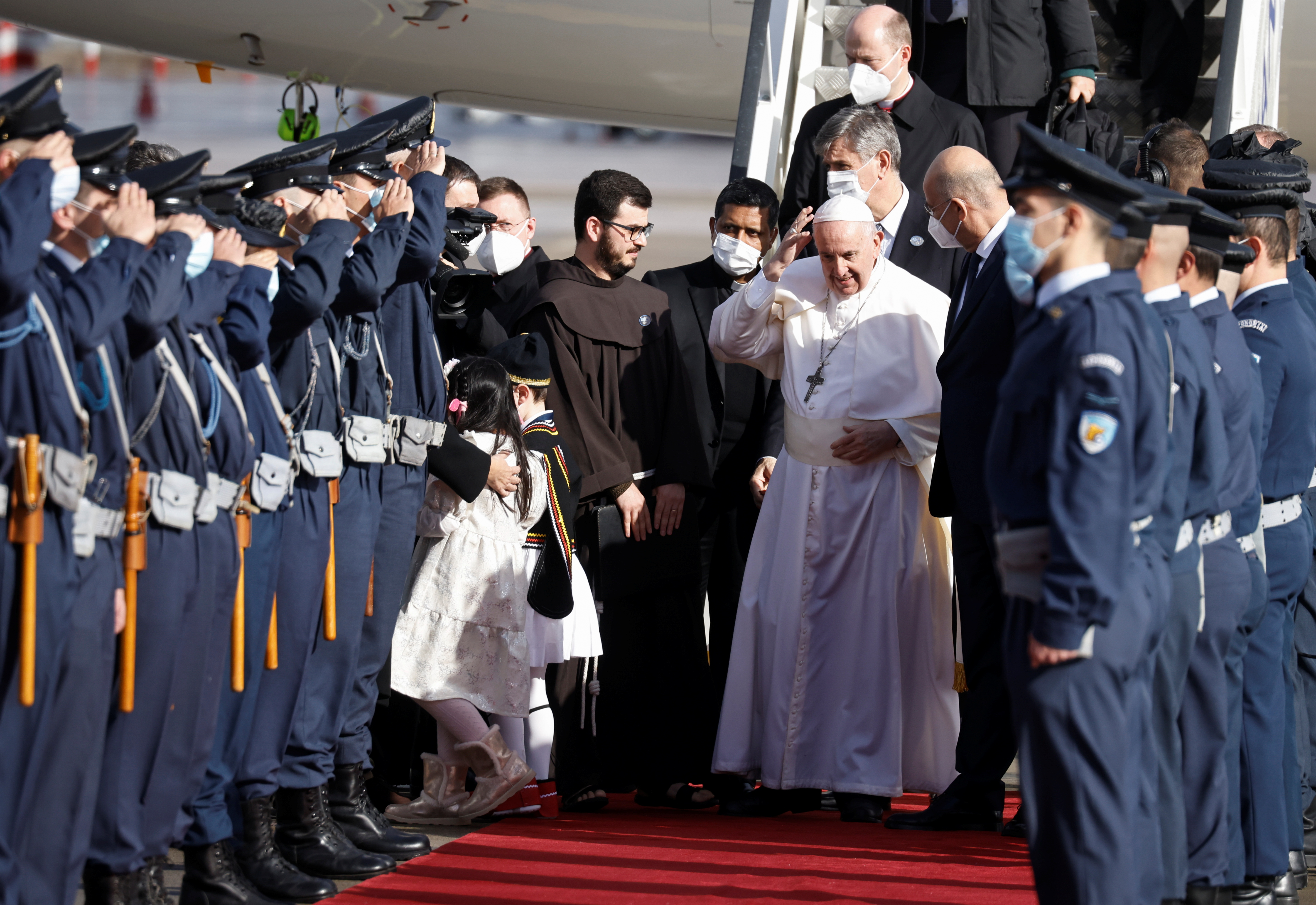 Pope Francis is welcomed by Greek Foreign Minister Nikos Dendias at Athens International Airport in Athens, Greece, December 4, 2021. REUTERS/Alkis Konstantinidis