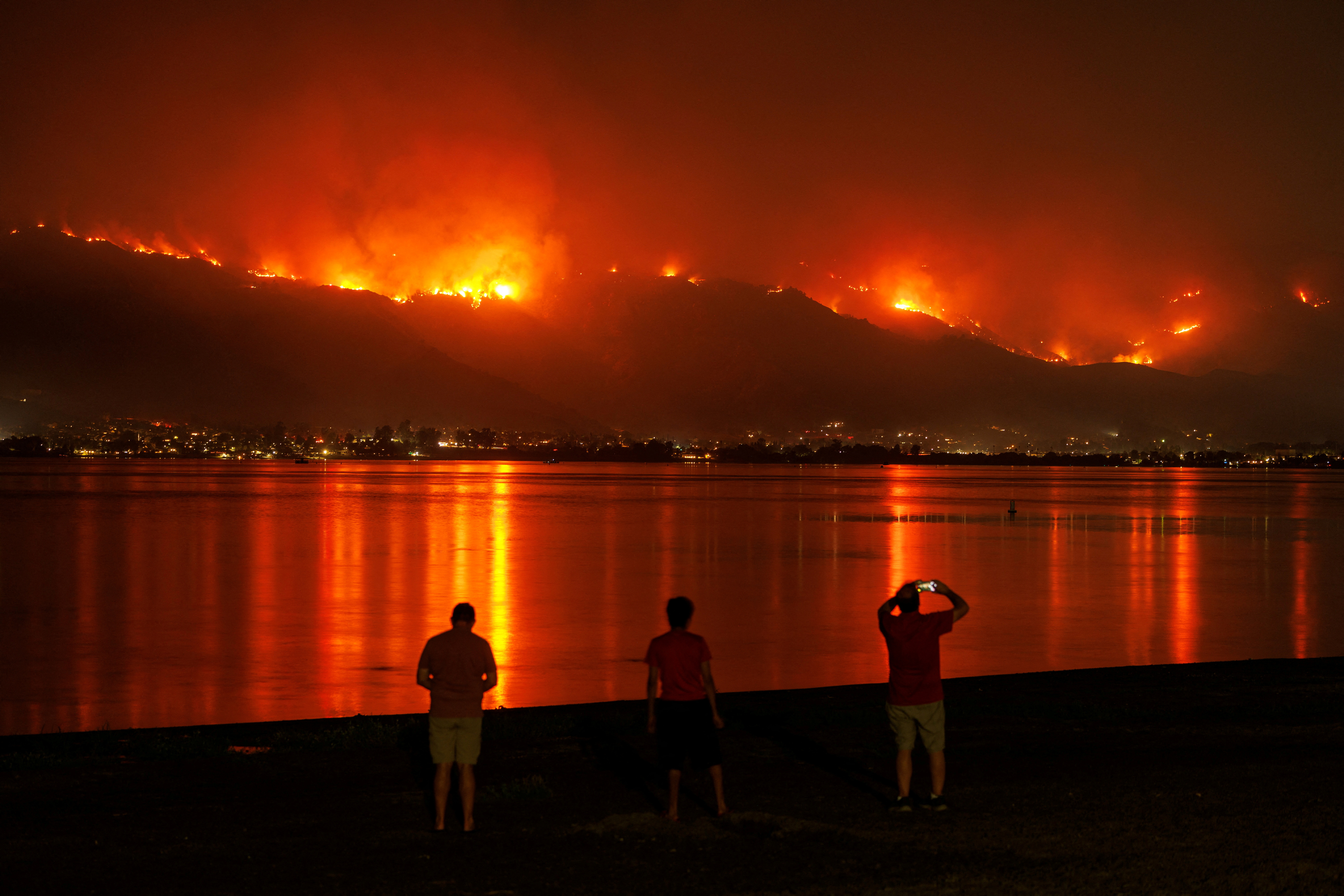 The Airport Fire burns along the hillside in Lake Elsinore