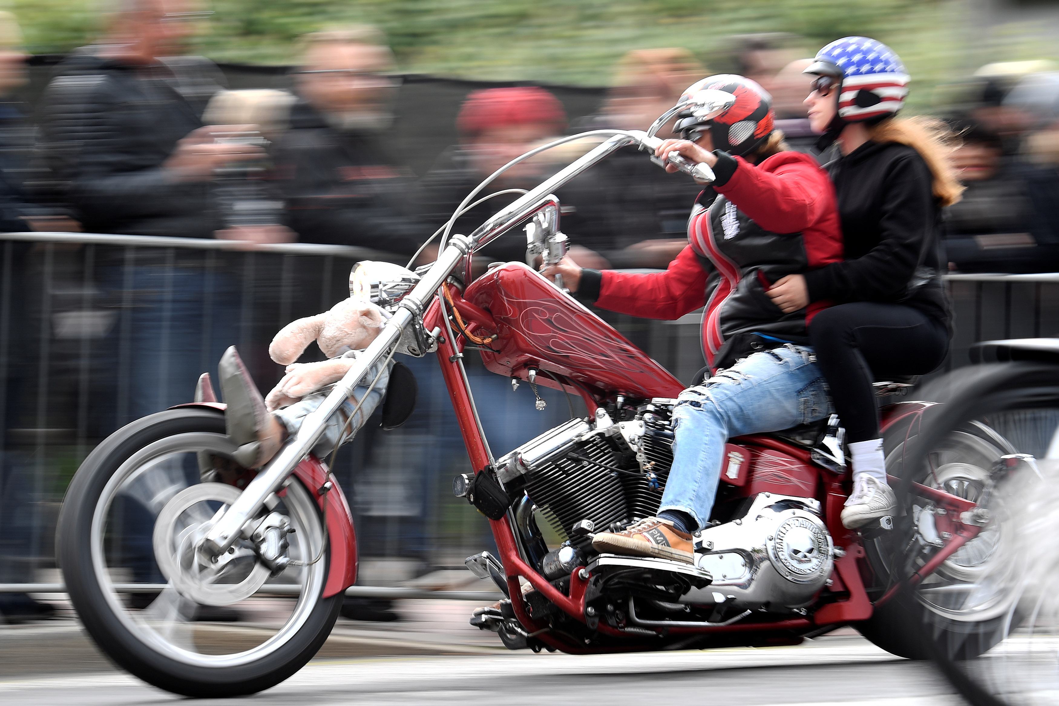 A biker rides his Harley-Davidson during a parade at the 
