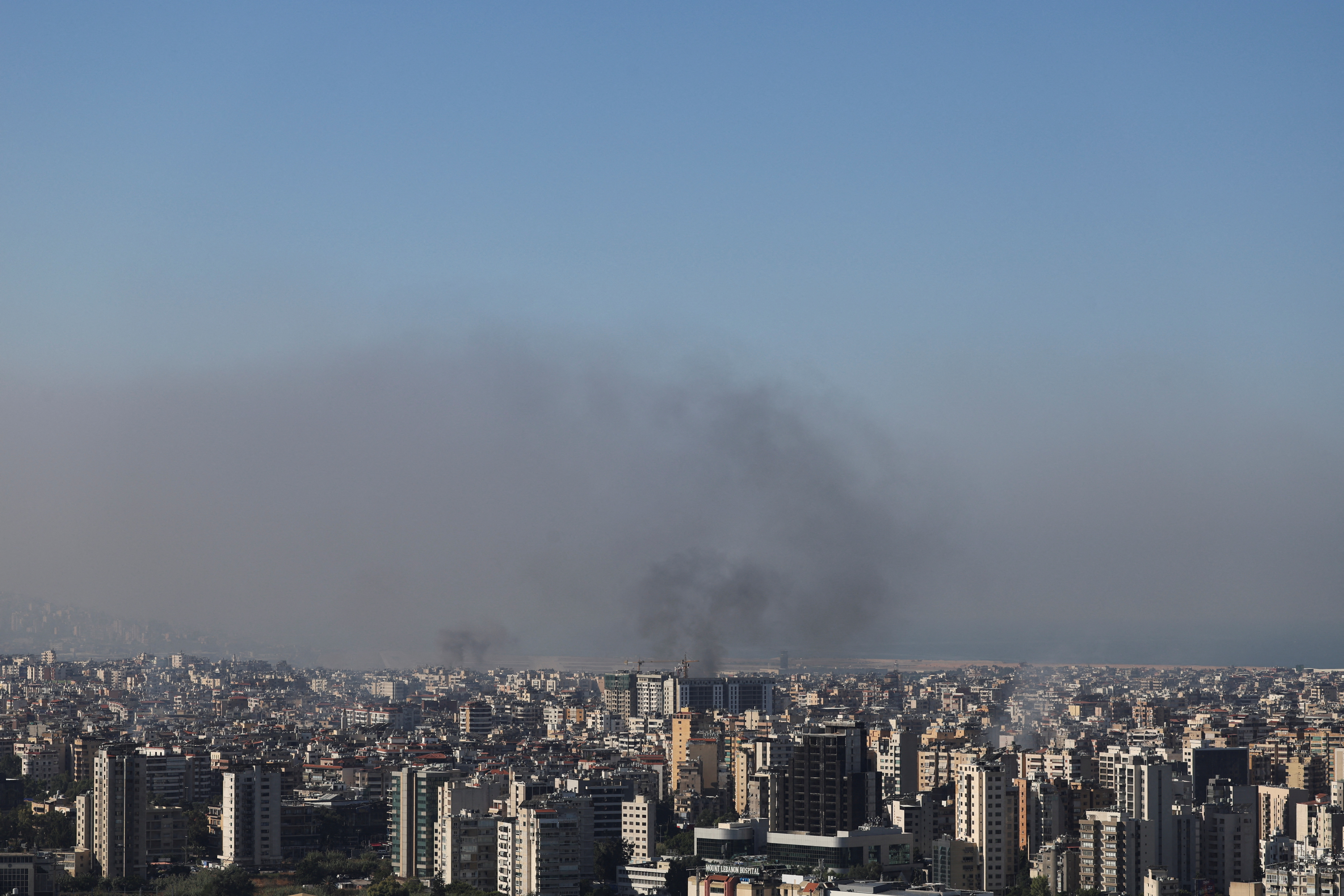 Smoke rises over Dahiyeh in Beirut's southern suburbs, after Israeli air strikes