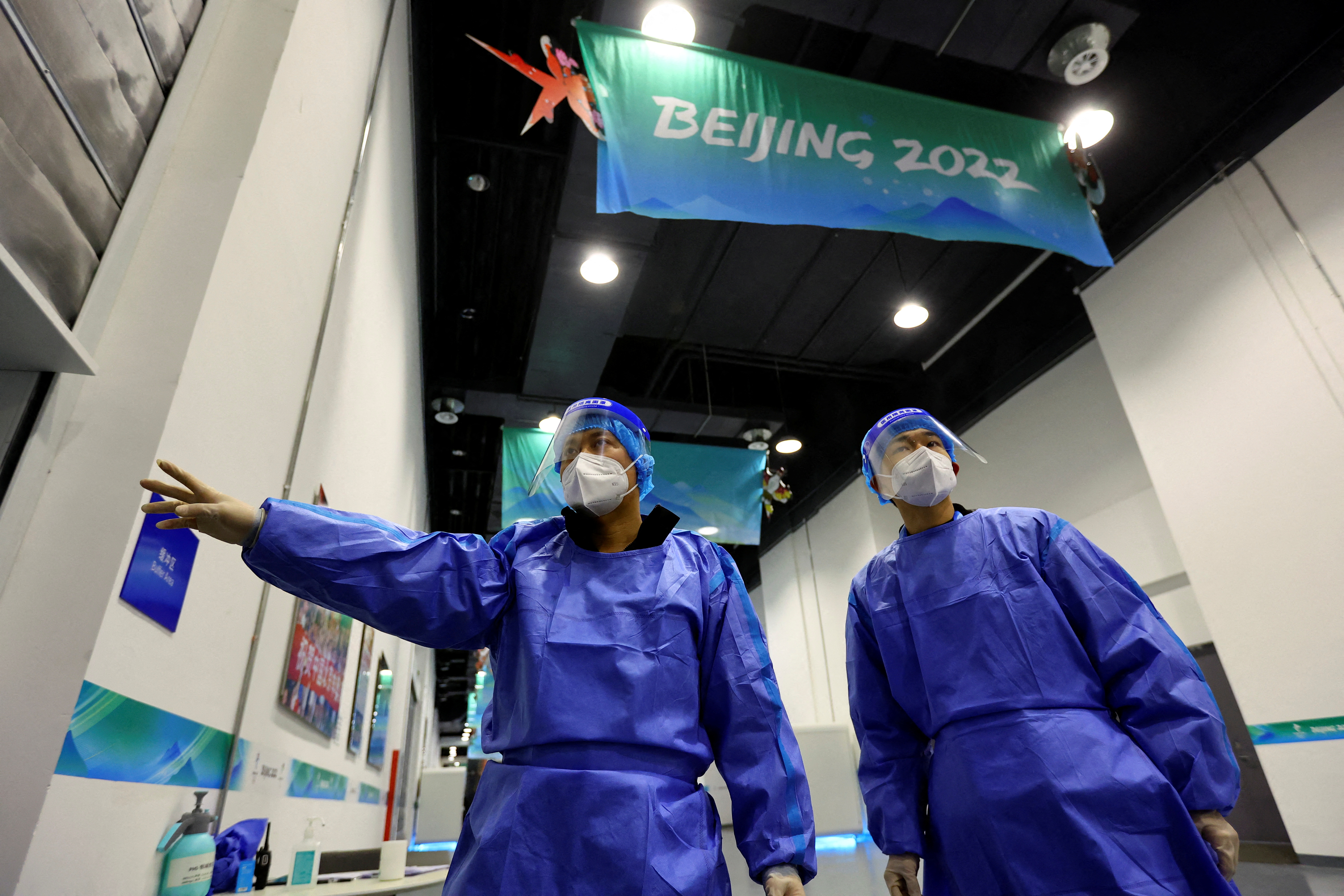 Members of a disinfection team are seen ahead of the Beijing 2022 Winter Olympics, in Beijing