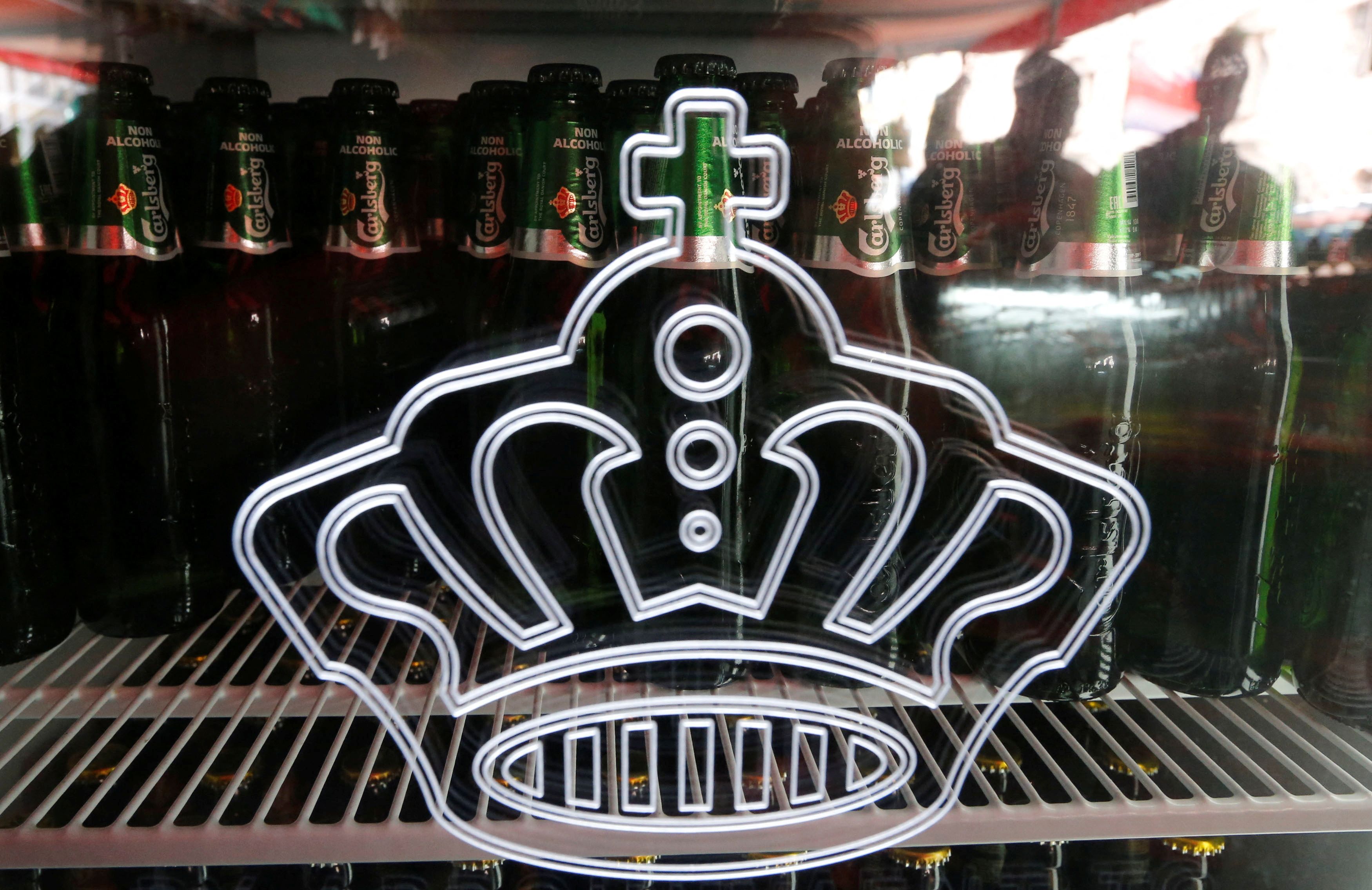 Bottles of Carlsberg beer are seen in fridge in a bar in St. Petersburg
