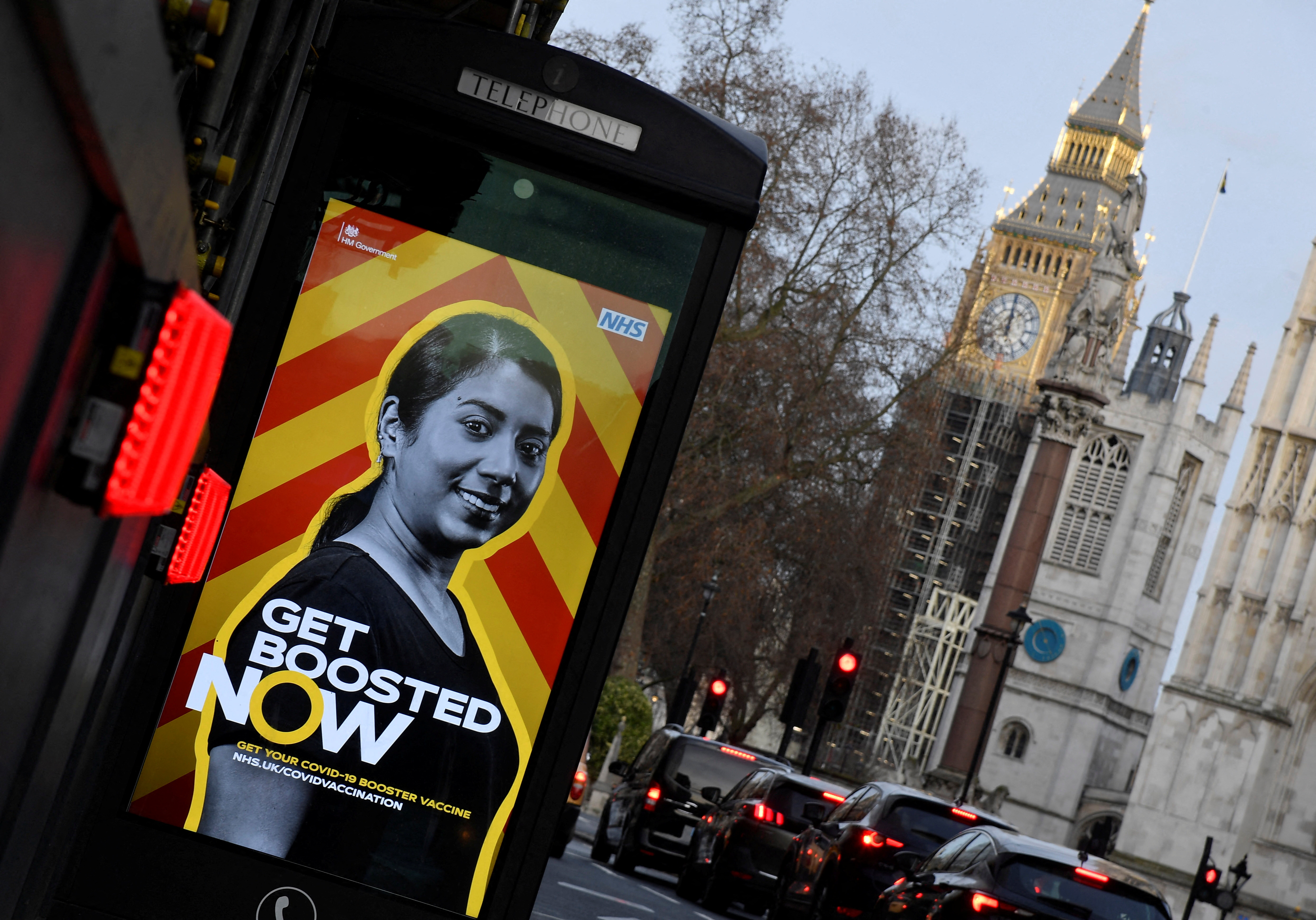 A public health advertisement encouraging people to get a booster vaccination is seen near Big Ben and the Houses of Parliament, amidst the spread of the coronavirus disease (COVID-19) pandemic, London