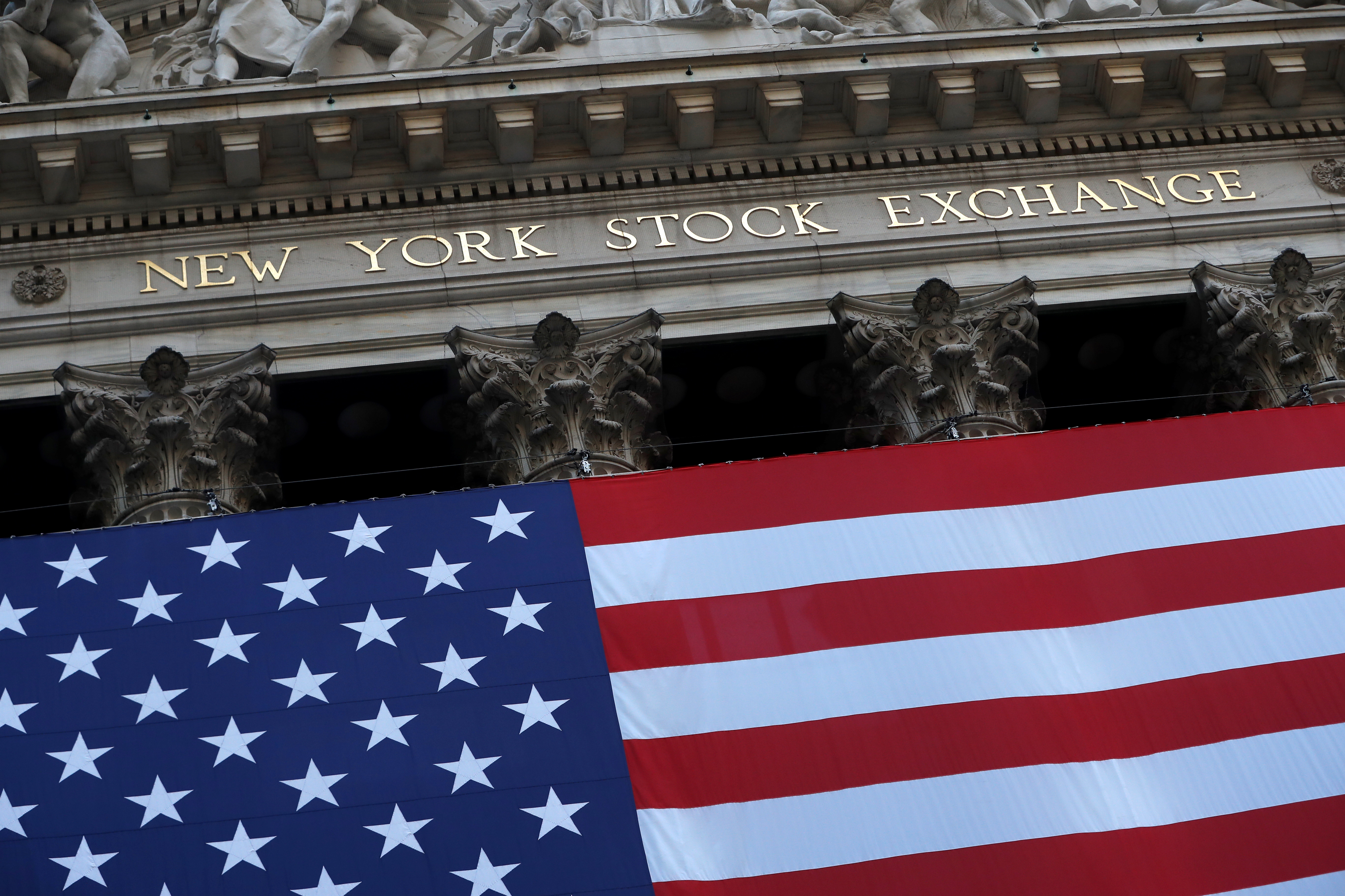 The U.S. flag is seen on the New York Stock Exchange (NYSE) following Election Day in Manhattan, New York City, U.S., November 4, 2020. REUTERS/Andrew Kelly