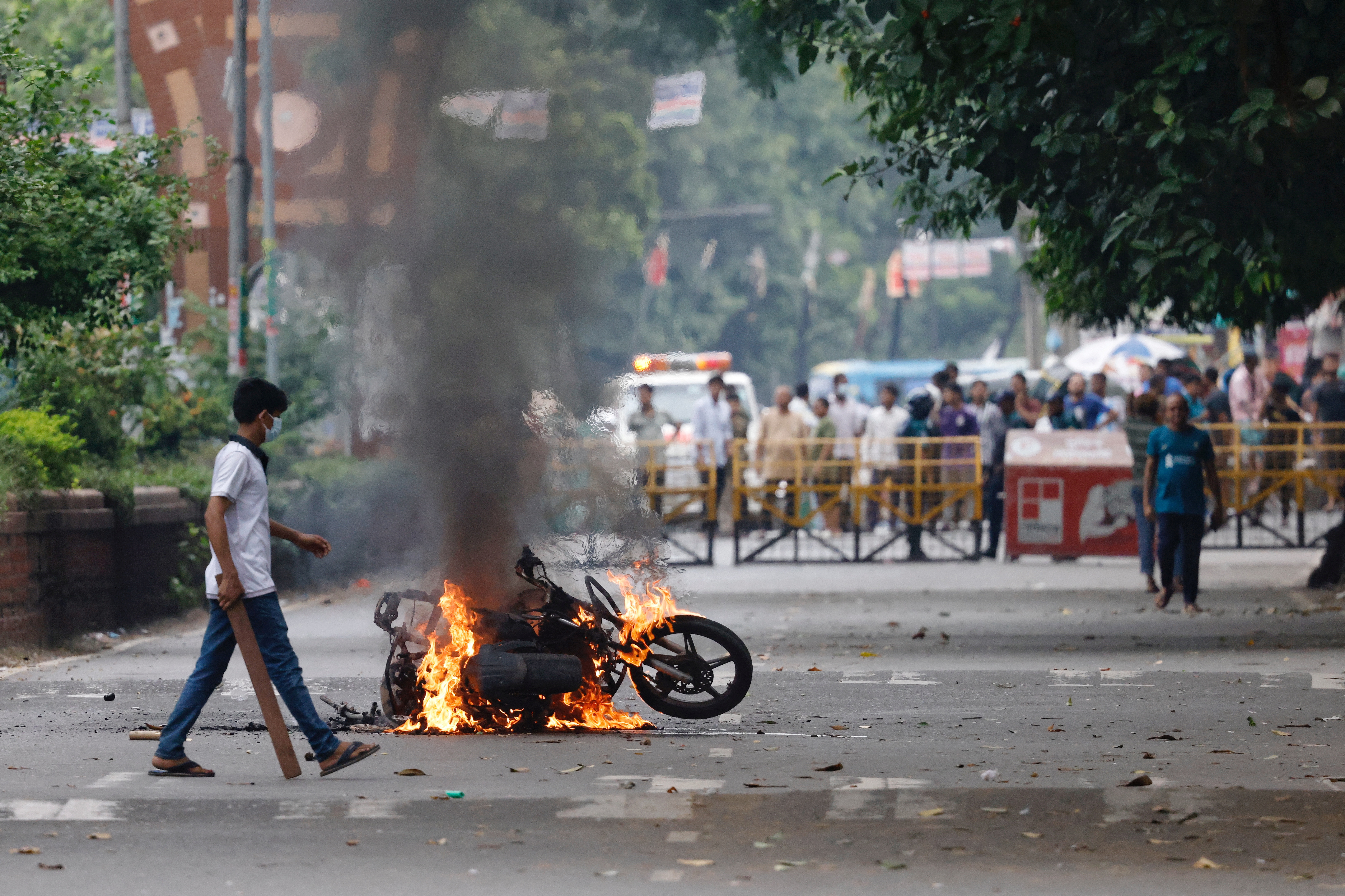 A motorcycle sets on fire at the campus of the University of Dhaka, a day after the clash with Bangladesh Chhatra League, in Dhaka