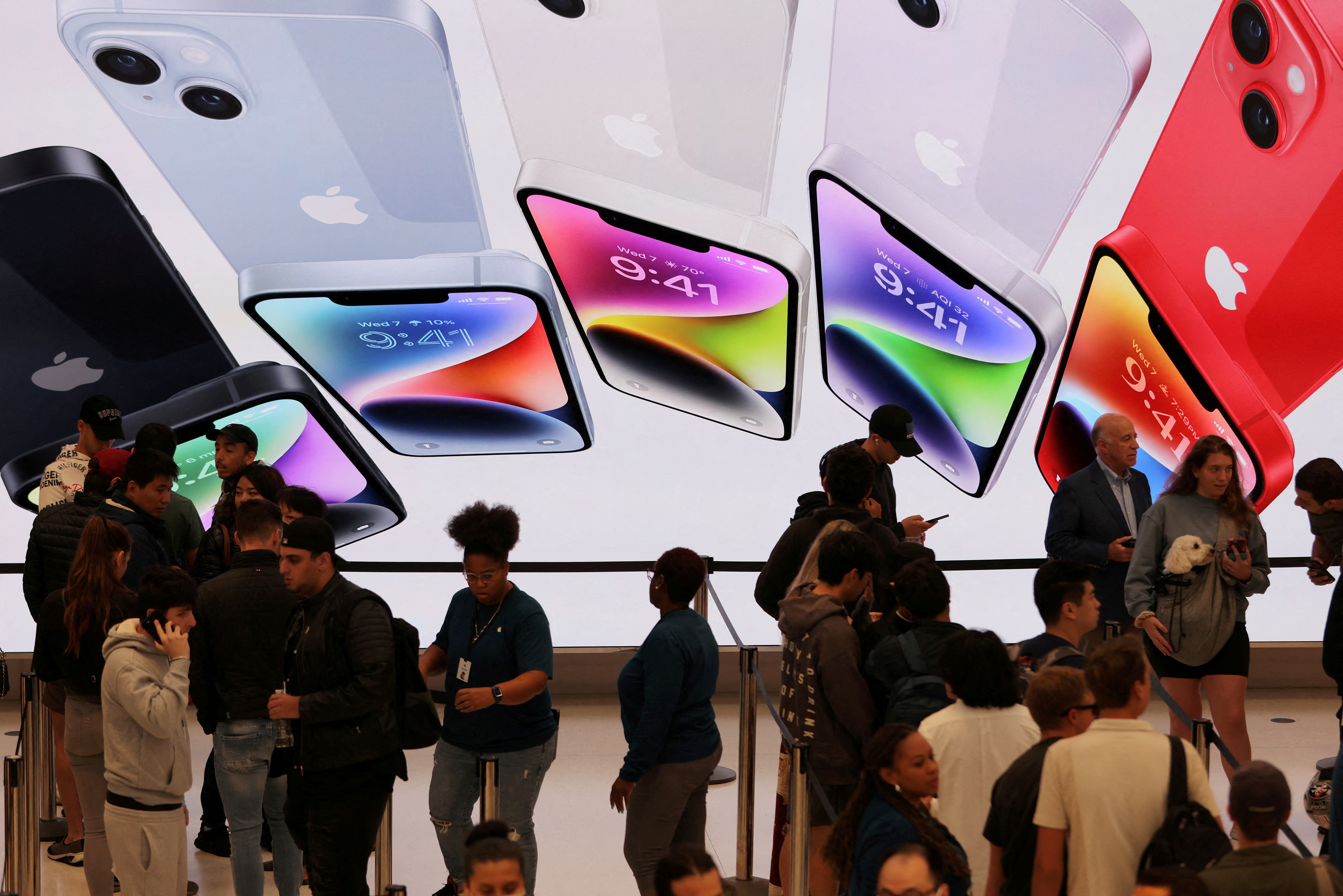 Customers queue at the Apple Fifth Avenue store for the release of the Apple iPhone 14 range in Manhattan, New York City