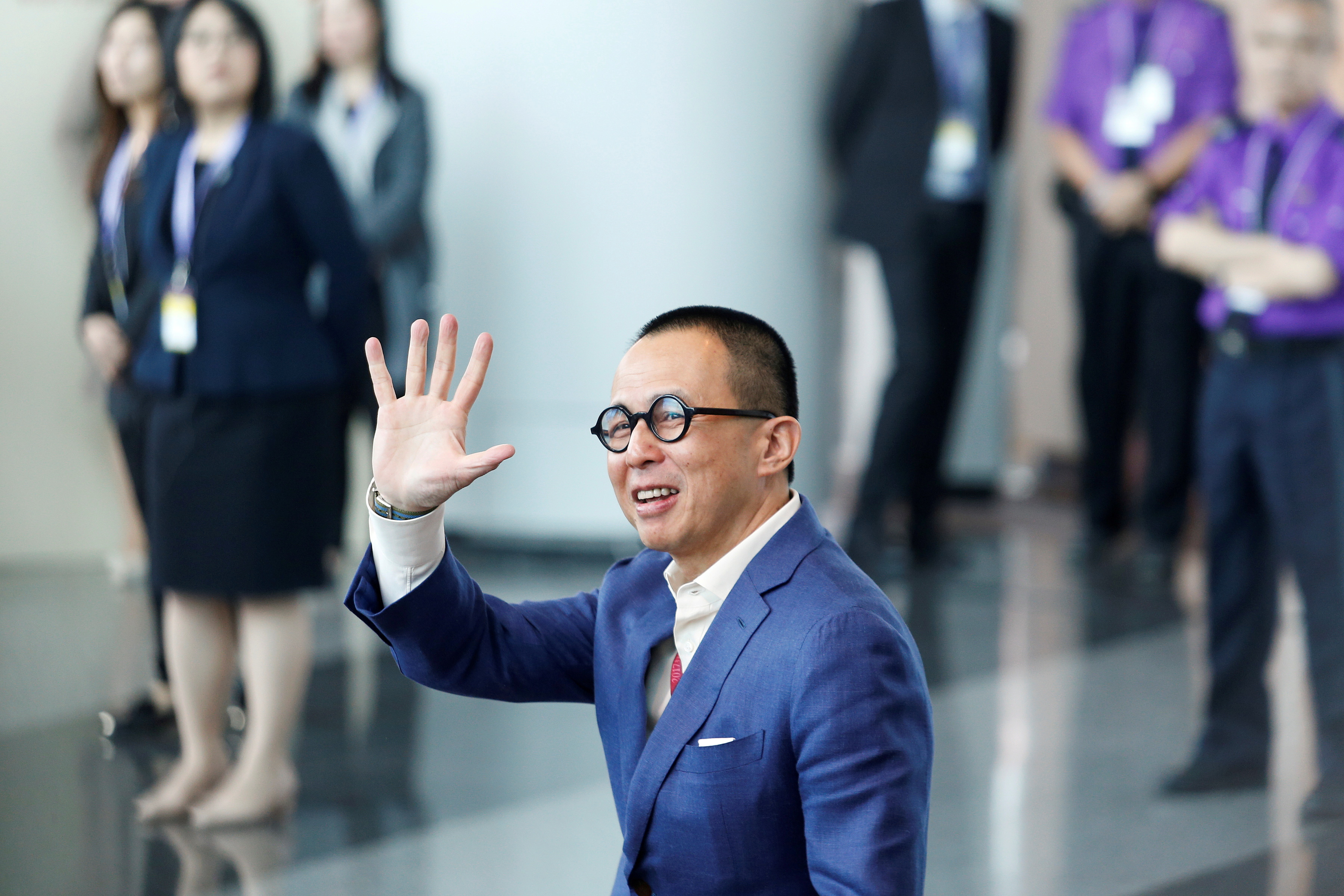 Richard Li, Hong Kong businessman and younger son of tycoon Li Ka-shing, waves as he arrives to vote during the election for Hong Kong's next Chief Executive in Hong Kong