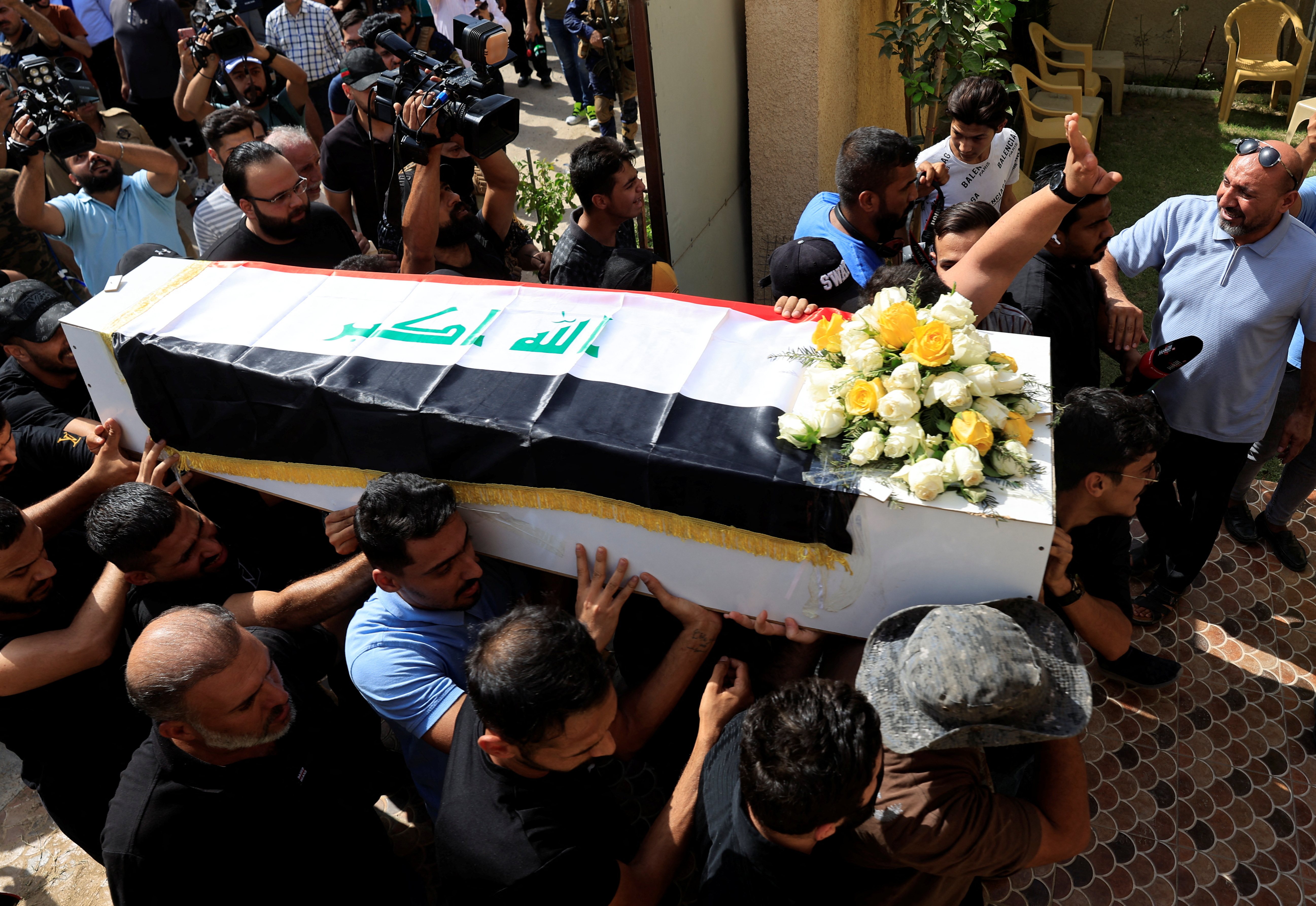 Funeral ceremony of a victim who was killed in an attack on a mountain resort, in Baghdad