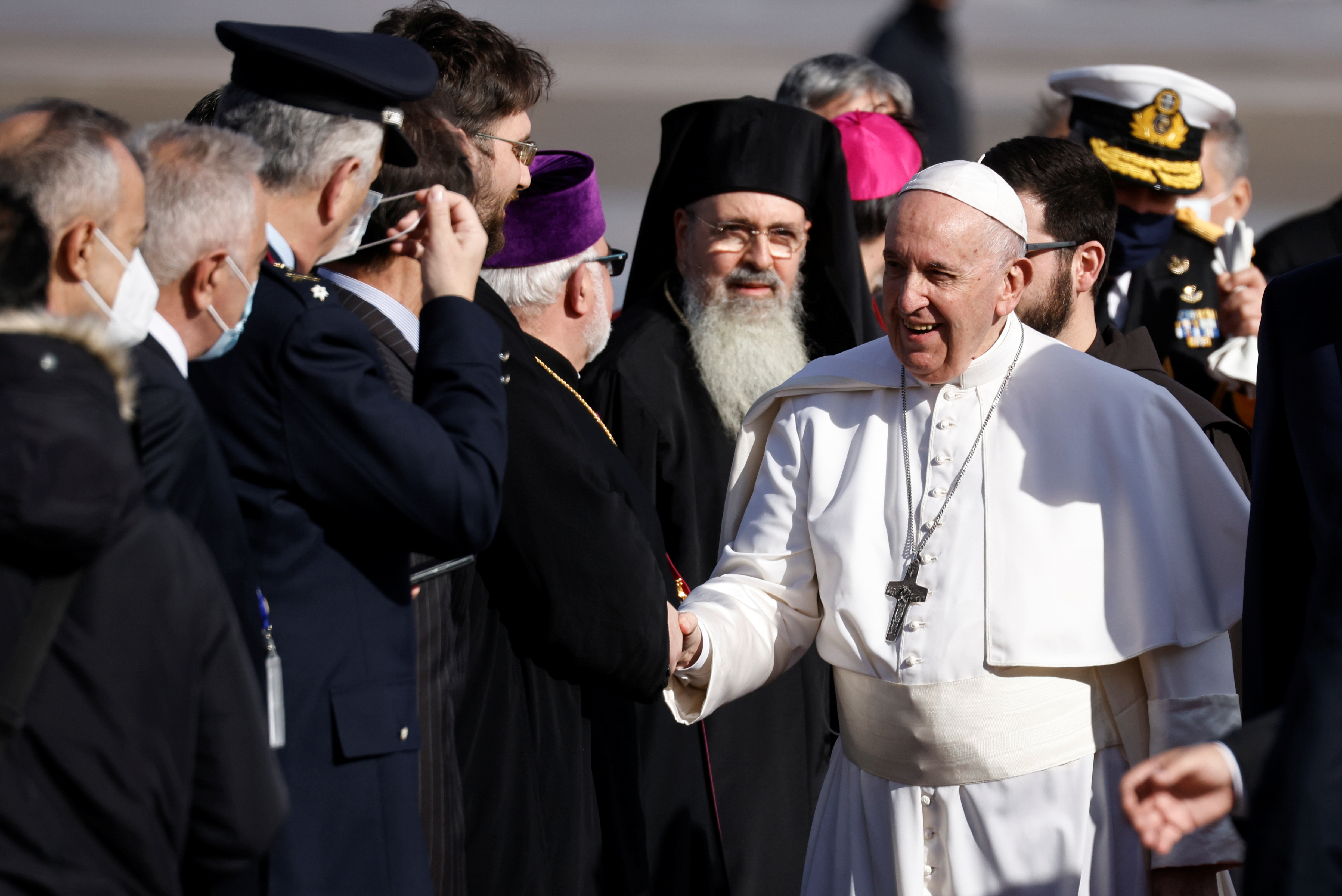 Pope Francis greets people as he arrives at Athens International Airport in Athens, Greece, December 4, 2021. REUTERS/Alkis Konstantinidis