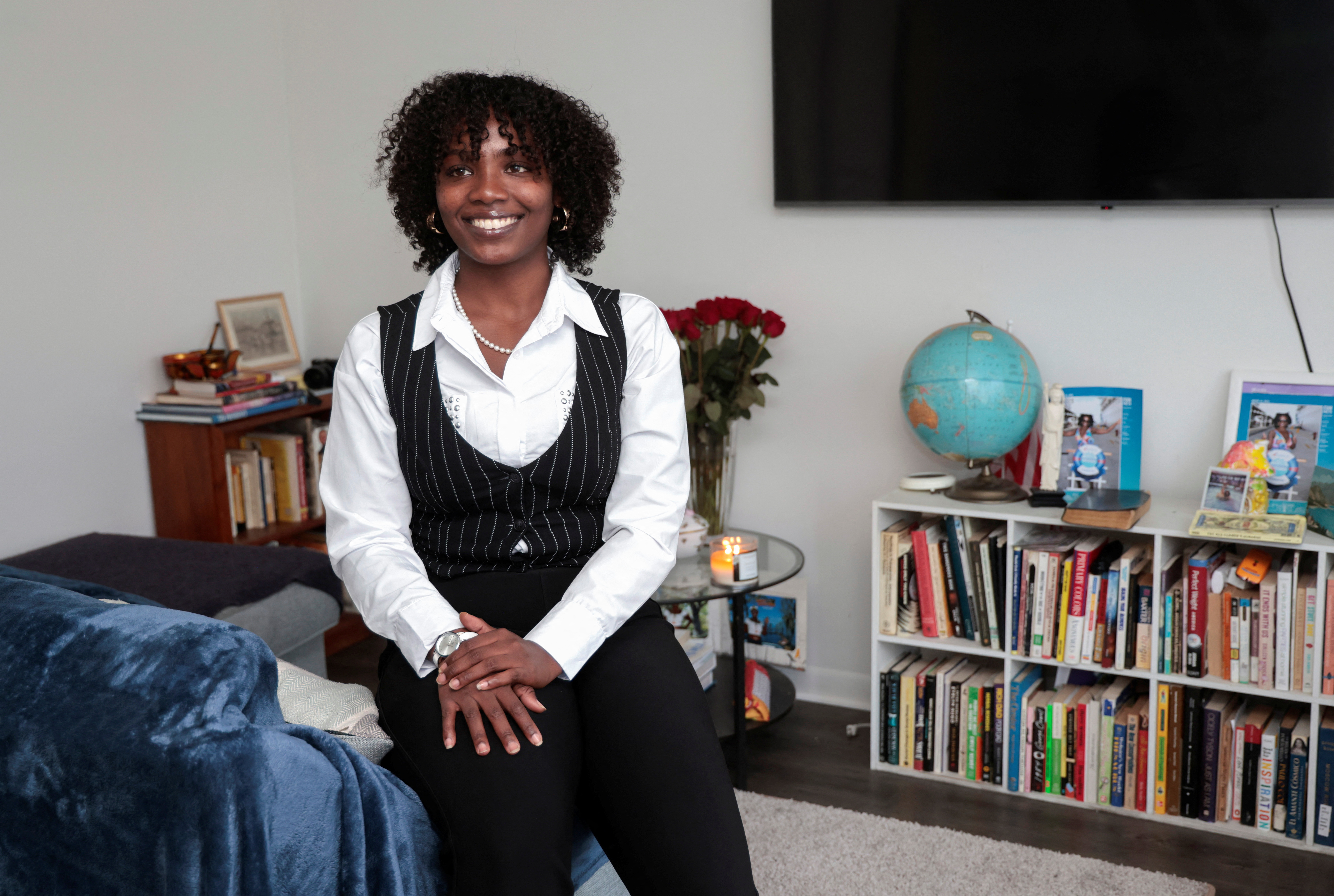 Tiesha Blackwell sits in her apartment where she works from home, in Lincoln Park, Michigan,