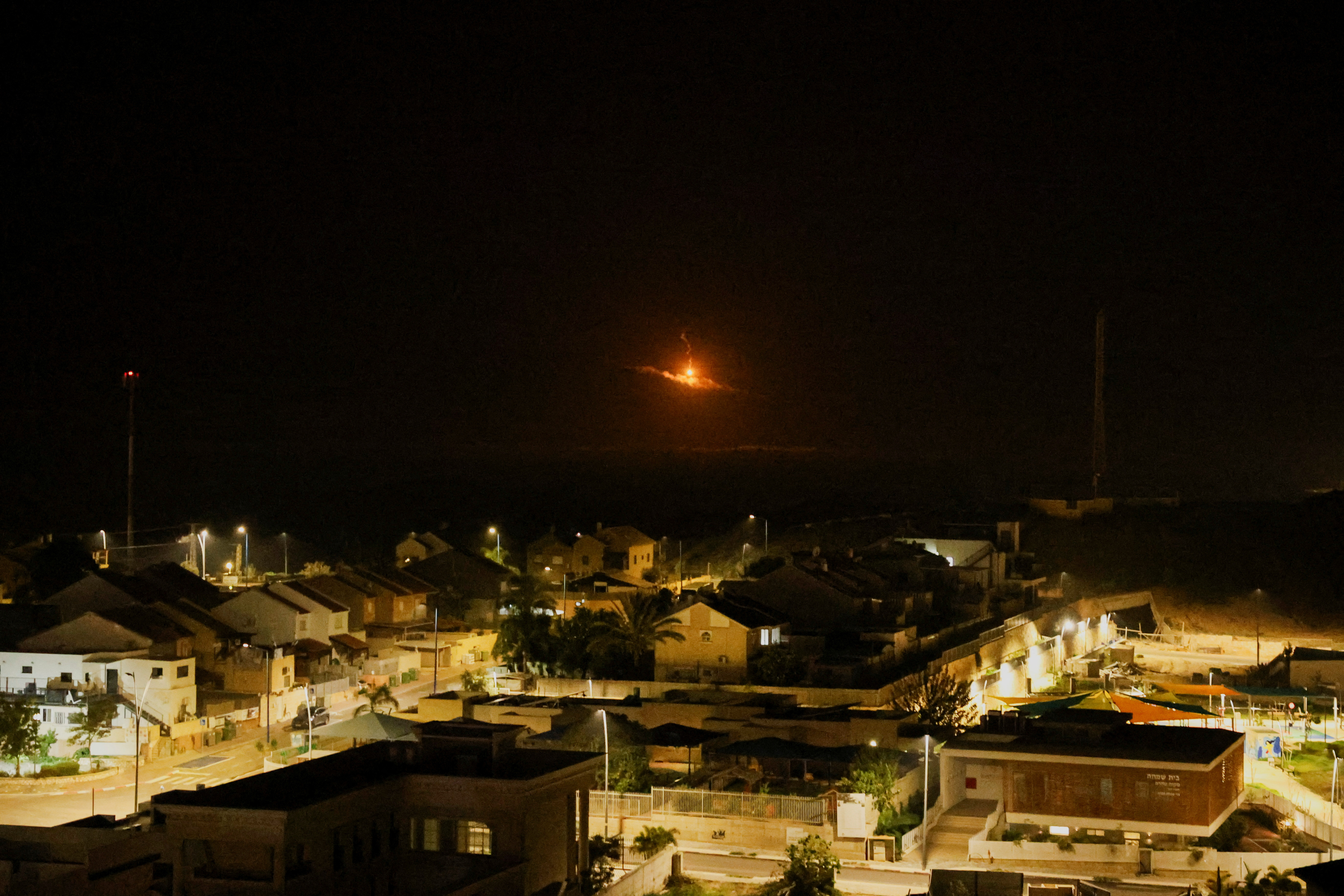 A flare falls over Gaza, as seen from southern Israel