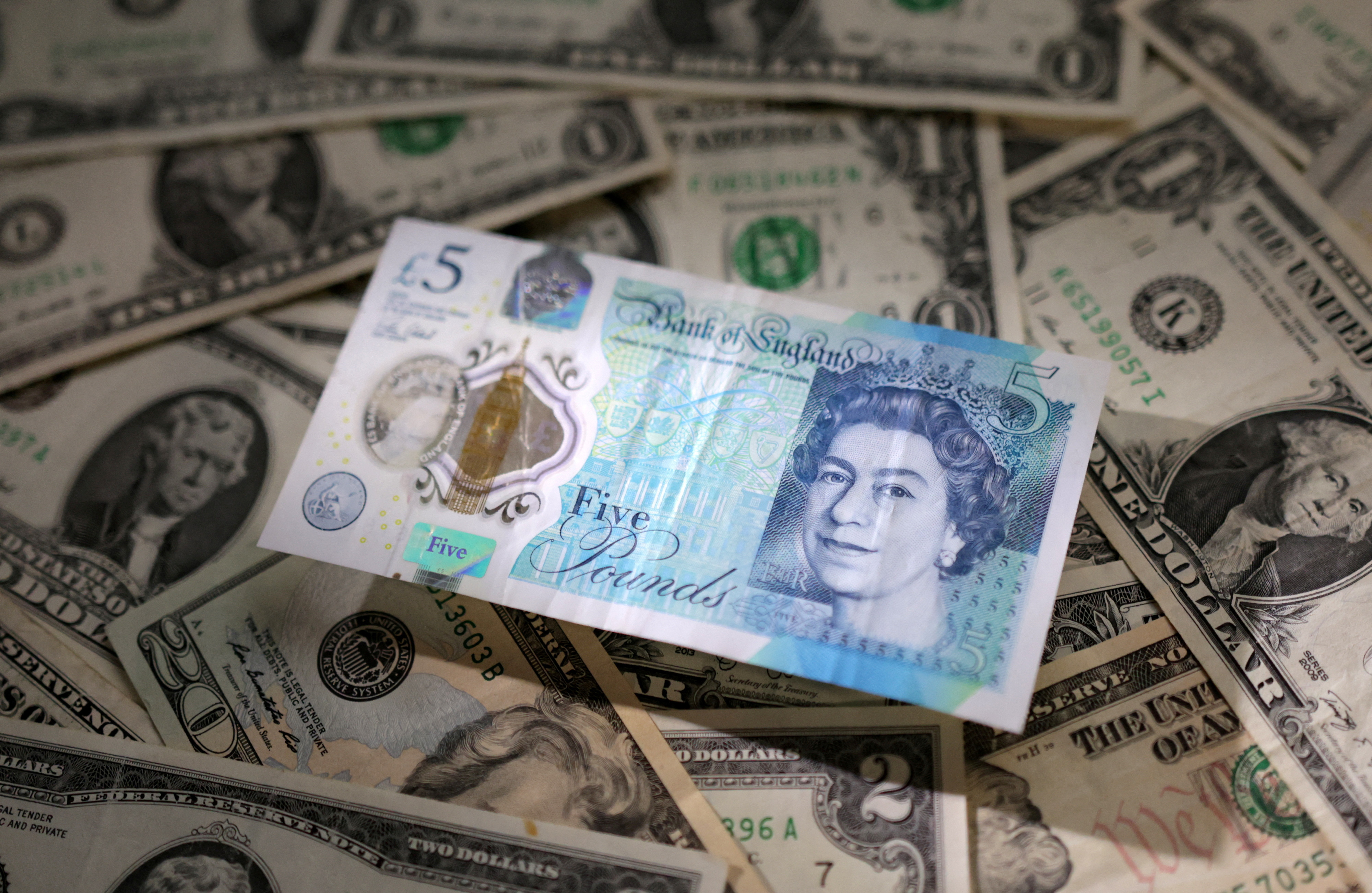 Illustration shows British Pound and U.S. dollar banknotes