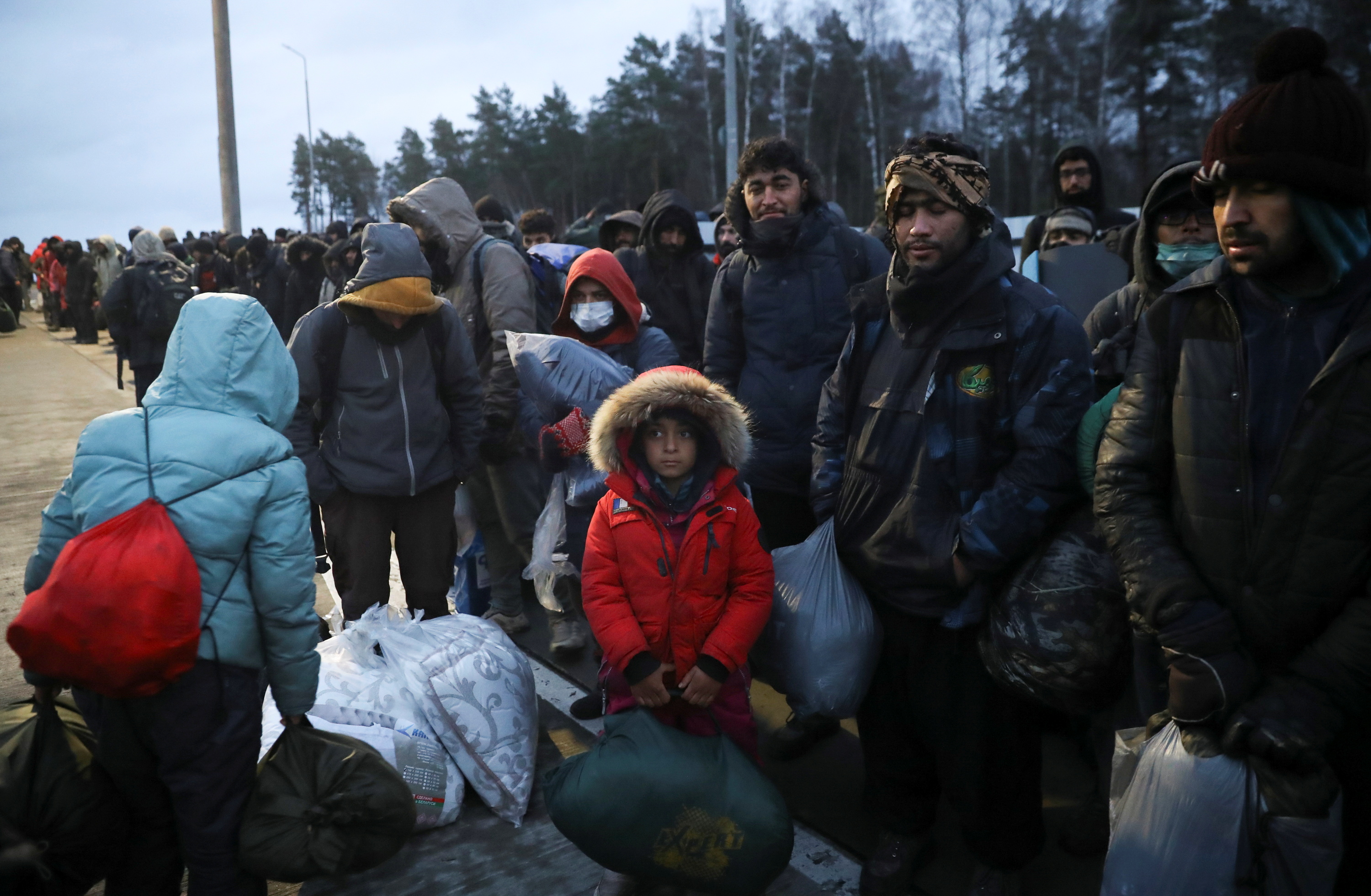 Migrants gather at a transport and logistics centre near the Belarusian-Polish border in the Grodno region, Belarus, November 18, 2021.  REUTERS/Kacper Pempel