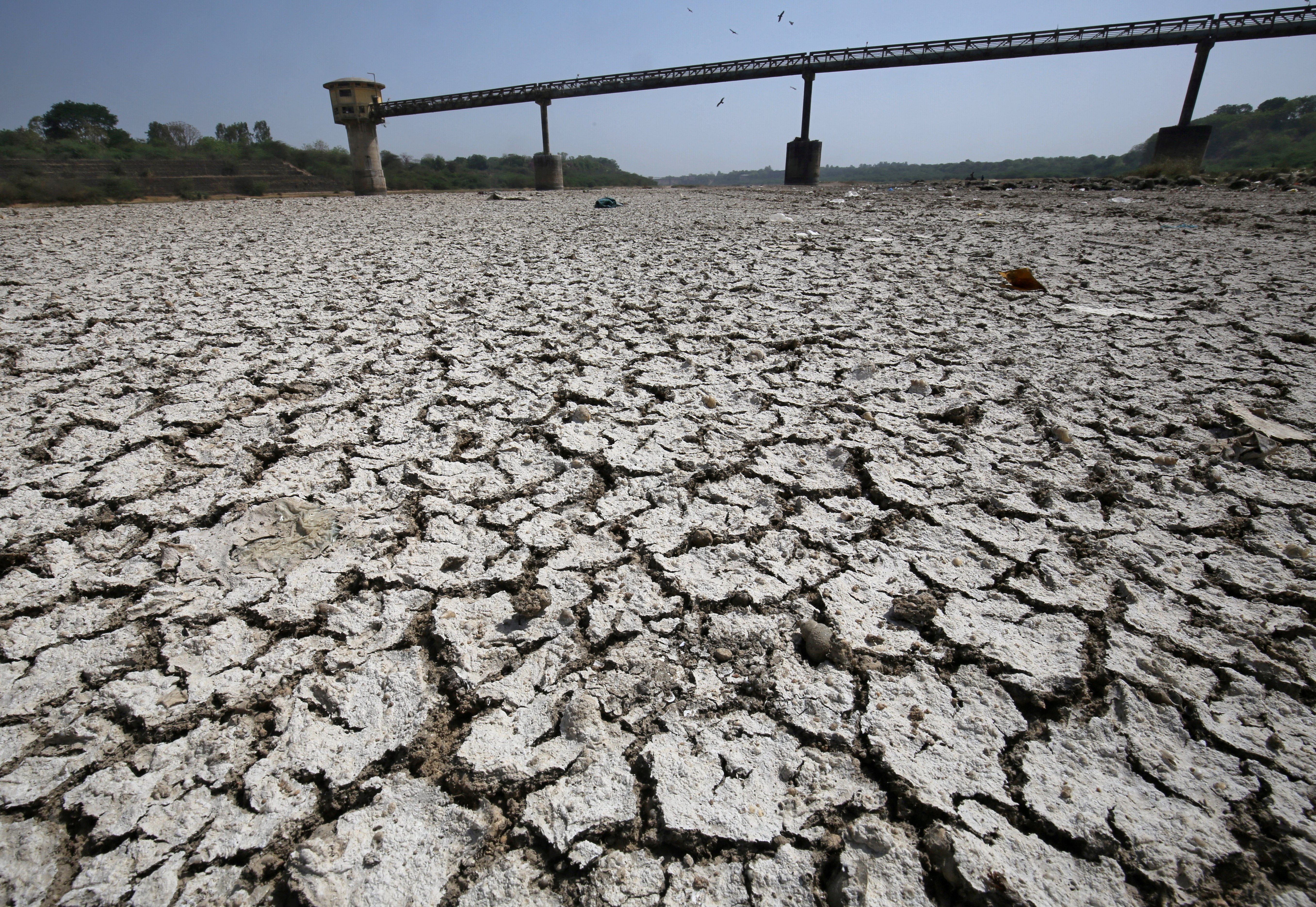 A water pump shed is seen in the dried-up portion of the Sabarmati river on a hot day on the outskirts of Ahmedabad