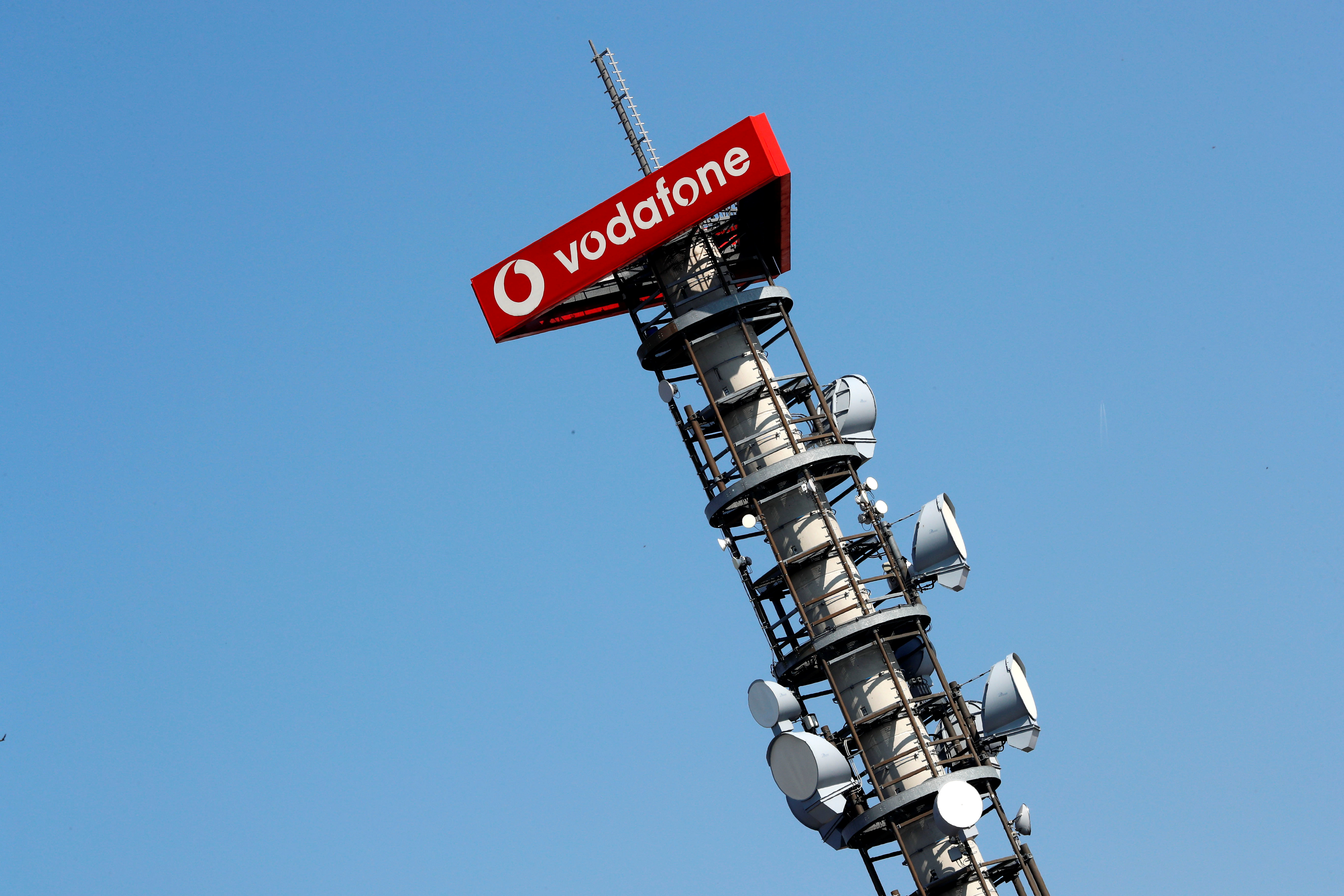 Different types of 4G, 5G and data radio relay antennas for mobile phone networks are pictured on a relay mast operated by Vodafone in Berlin