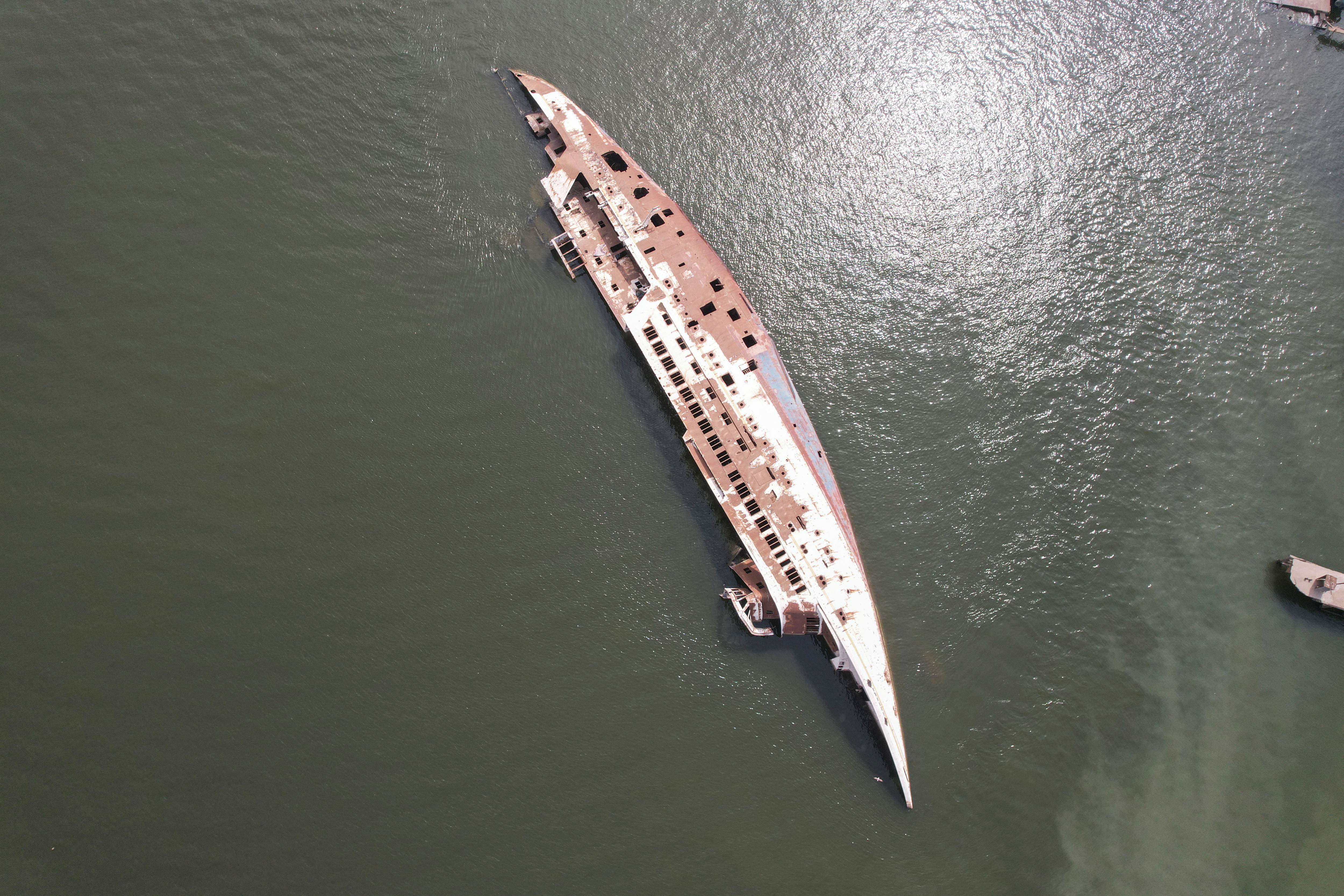 An aerial view of the 'Al-Mansur' yacht, once belonging to former Iraqi President Saddam Hussein, which has been lying on the water bed for years in the Shatt al-Arab waterway, in Basra