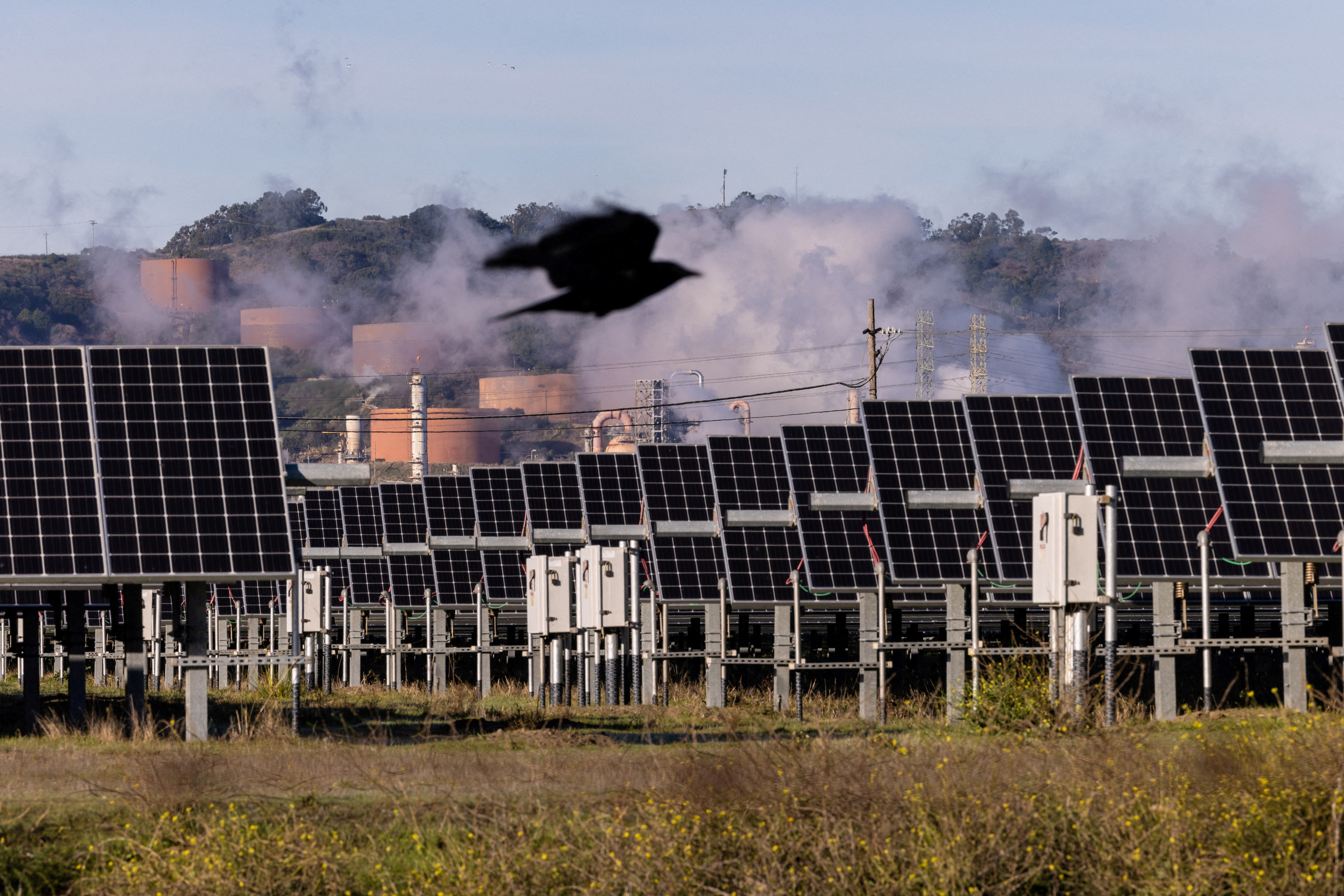 Solar panels are see next to a Chevron refinery in Richmond