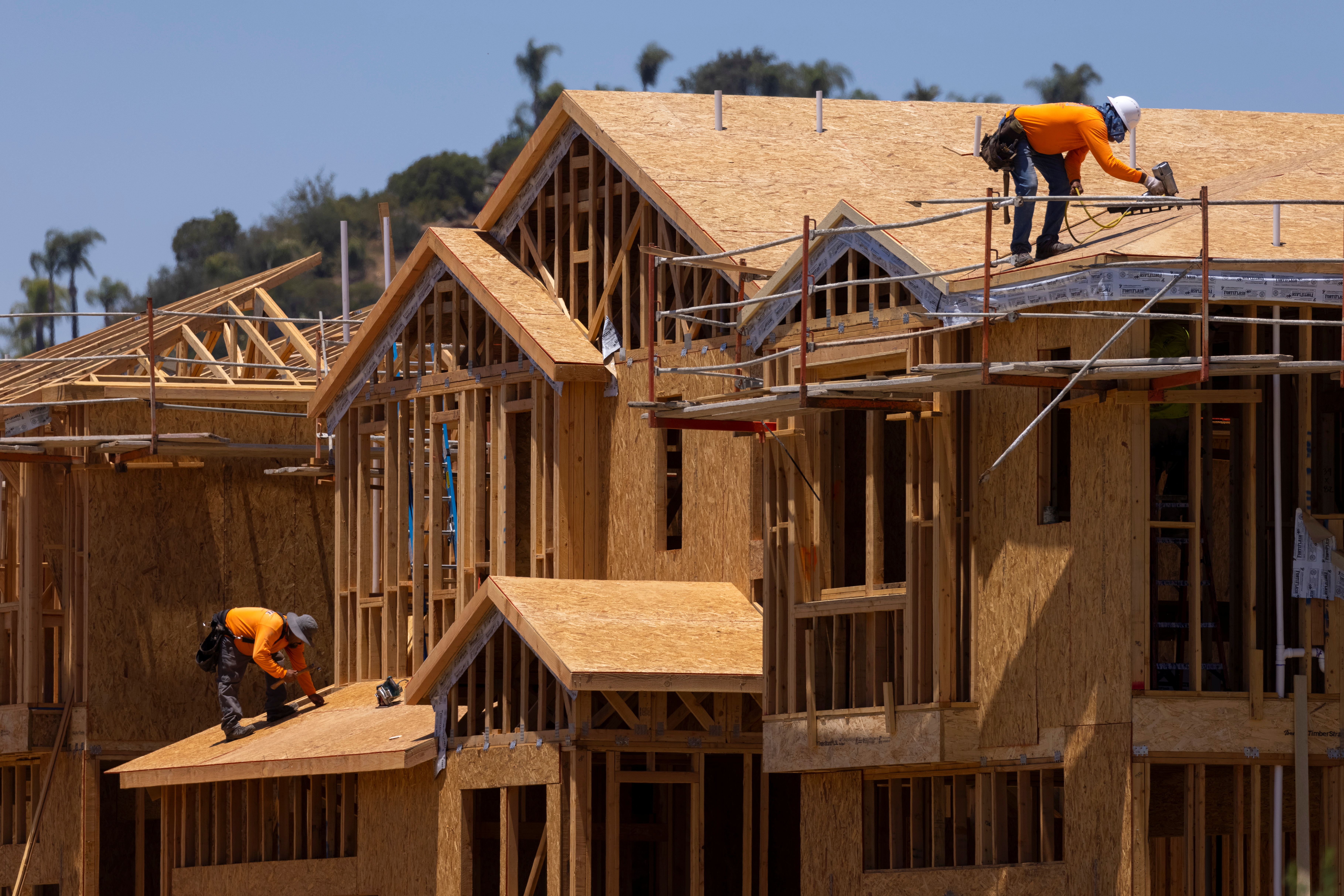 Residential single family homes construction by KB Home are shown under construction in the community of Valley Center, California, U.S. June 3, 2021.   REUTERS/Mike Blake
