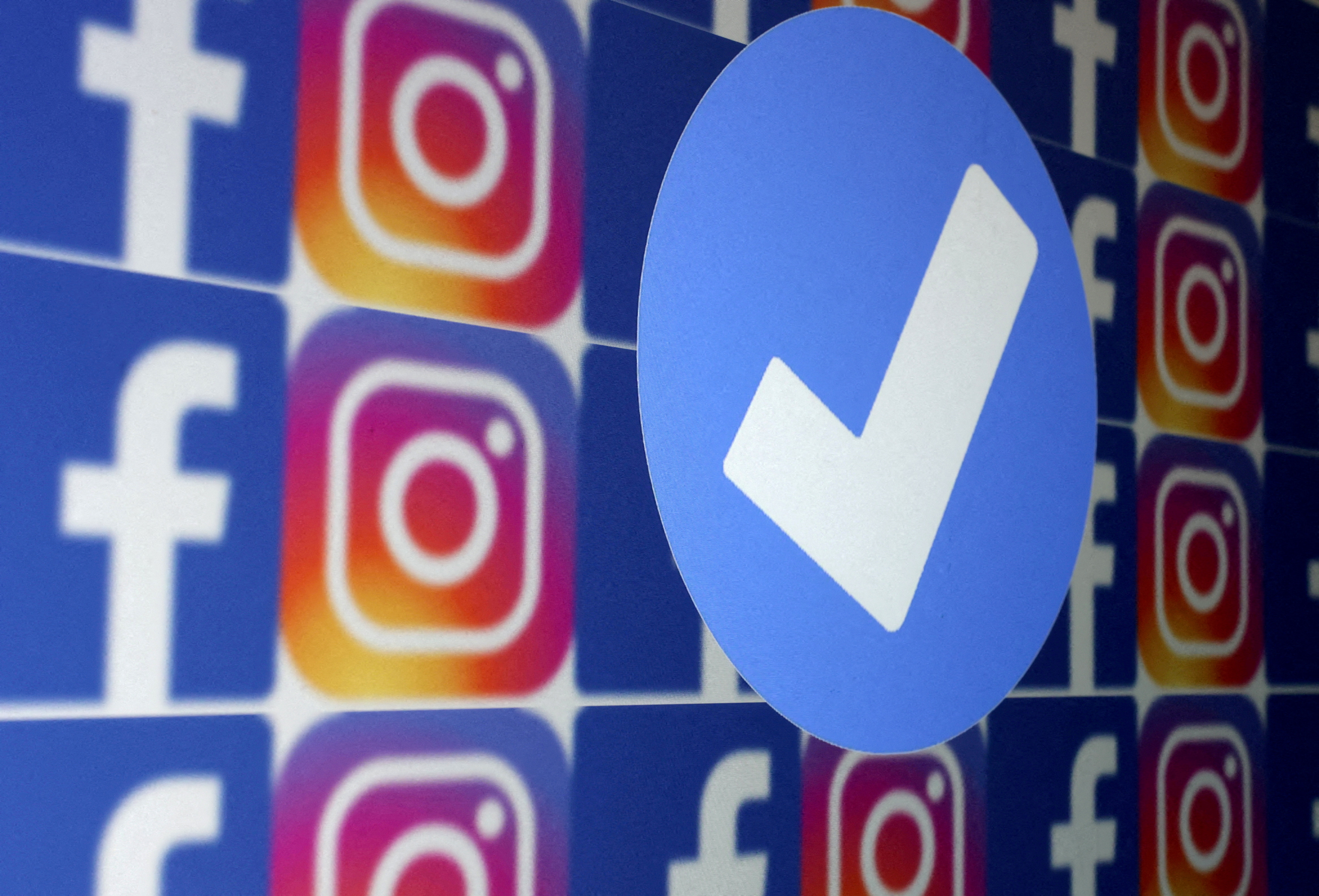 Illustration shows blue verification badge, Facebook and Instagram logos