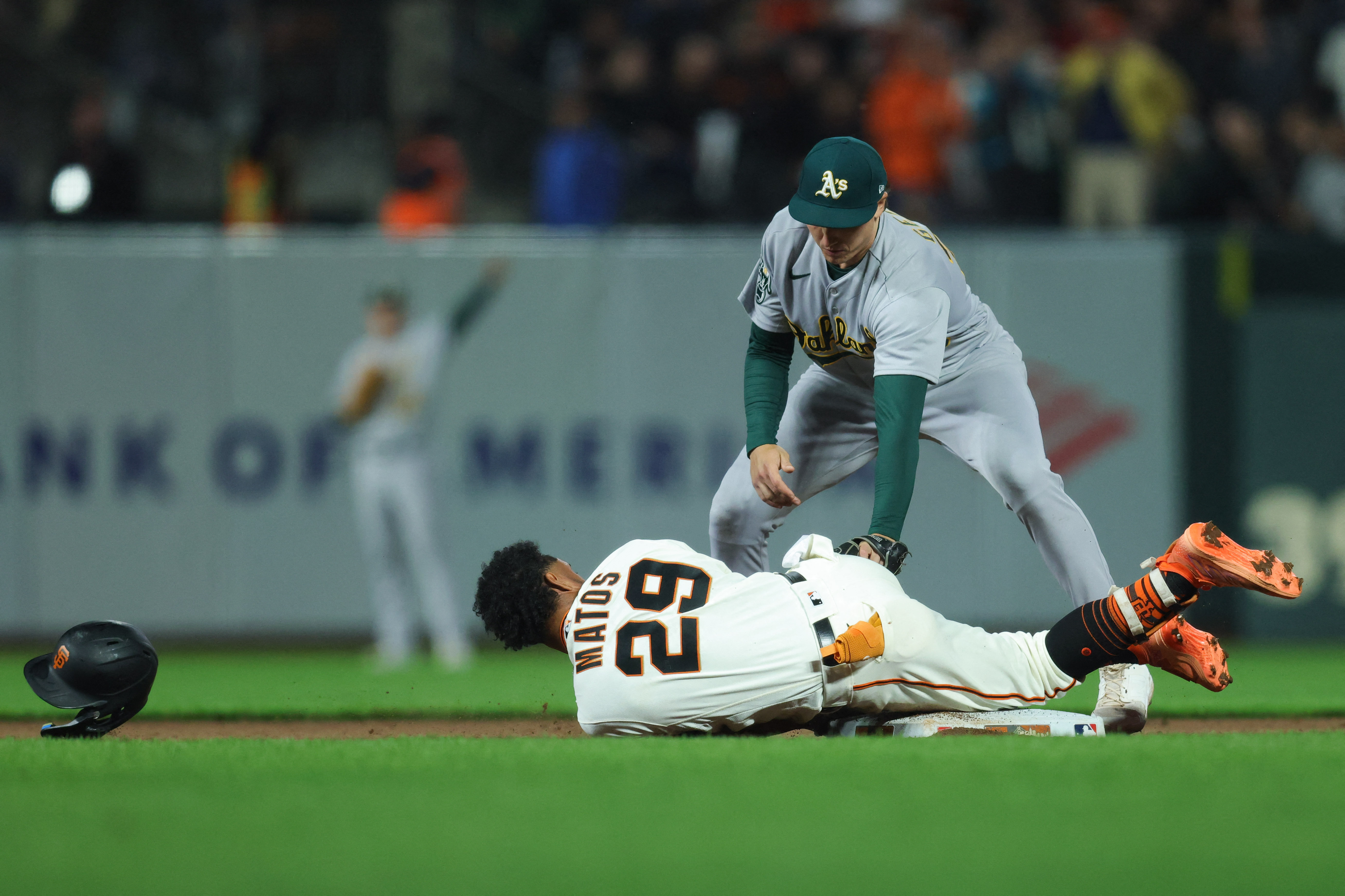 San Francisco Giants' Austin Slater (13), Luis Matos (29), and