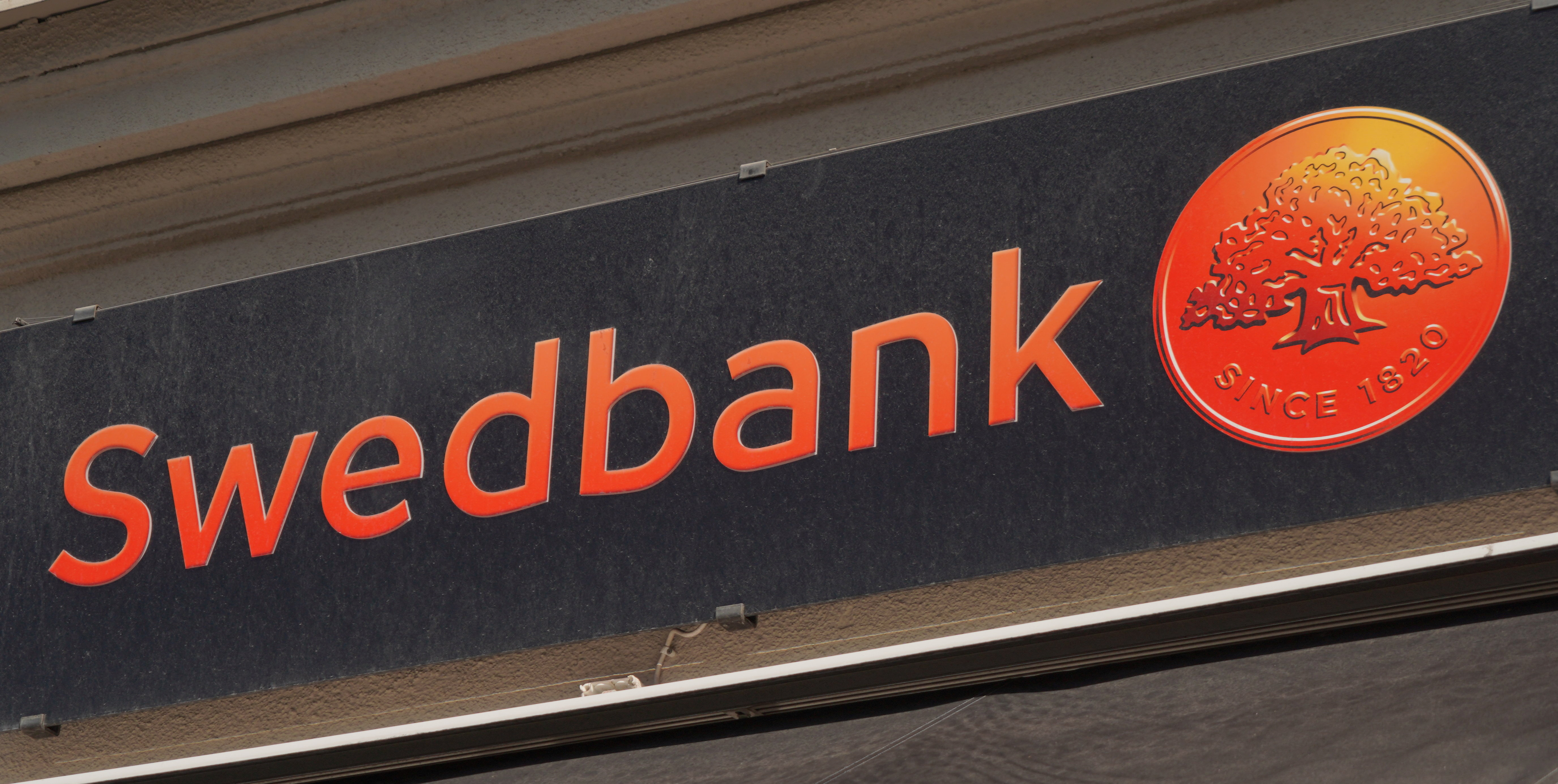 The Swedbank logo is seen outside a branch in central Stockholm