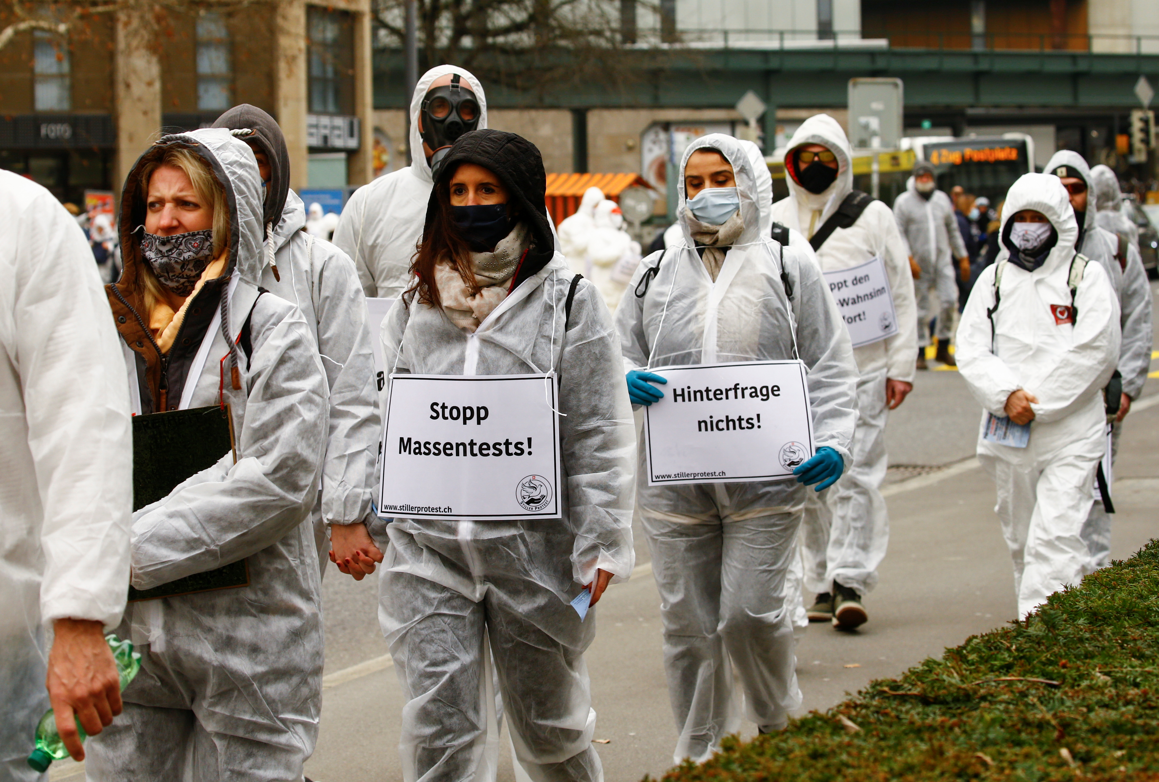 Demonstrators march amid the coronavirus disease (COVID-19) pandemic in Zug, Switzerland, February 6, 2021. REUTERS/Arnd Wiegmann