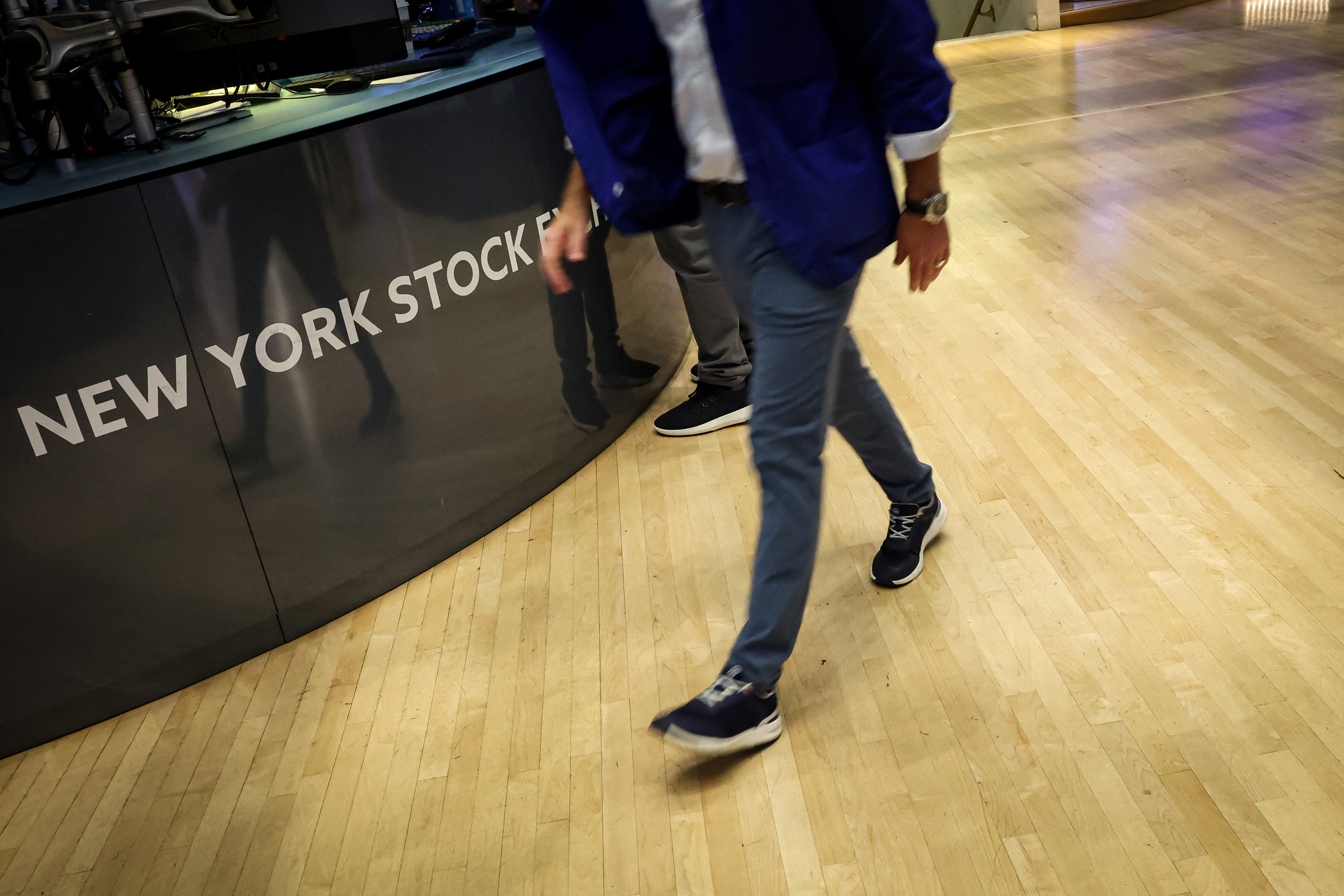 Traders work on the floor of the NYSE in New York