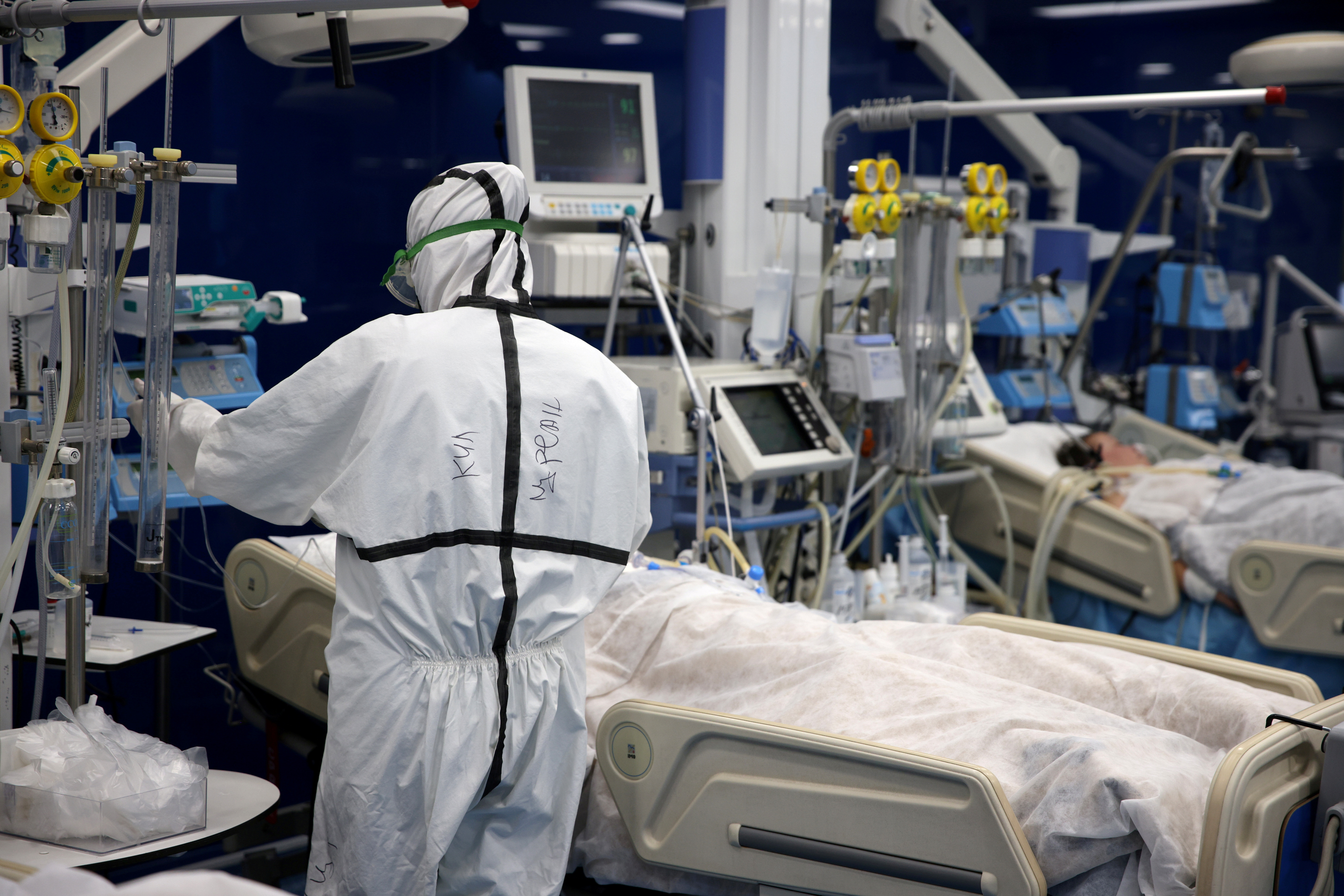 A medic tends to coronavirus disease (COVID-19) patients at the intensive care unit (ICU) of Pirogov hospital in Sofia, Bulgaria, October 15, 2021. REUTERS/Stoyan Nenov