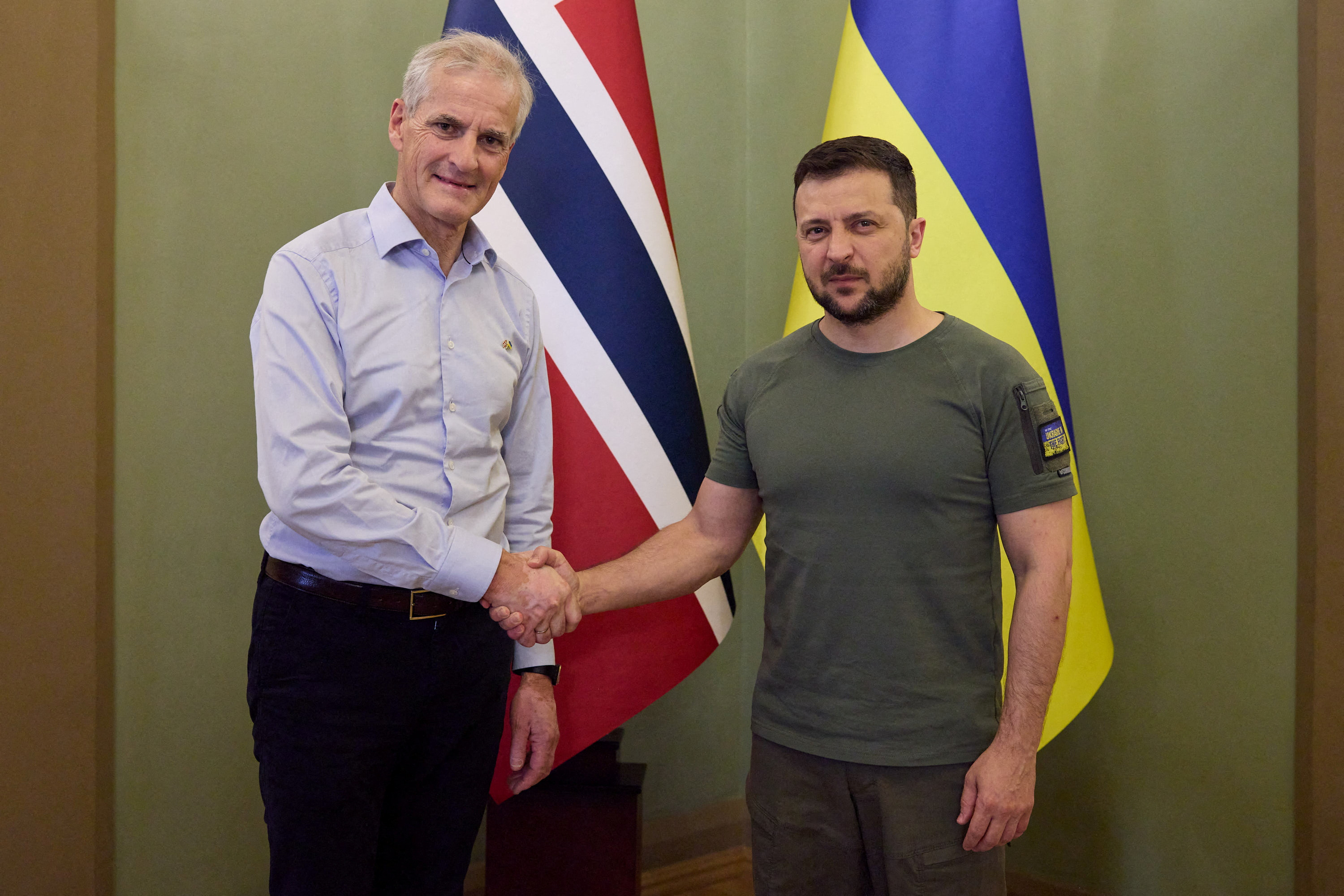 Norway's Prime Minister Stoere and Ukraine's President Zelenskiy shake hands before a meeting in Kyiv