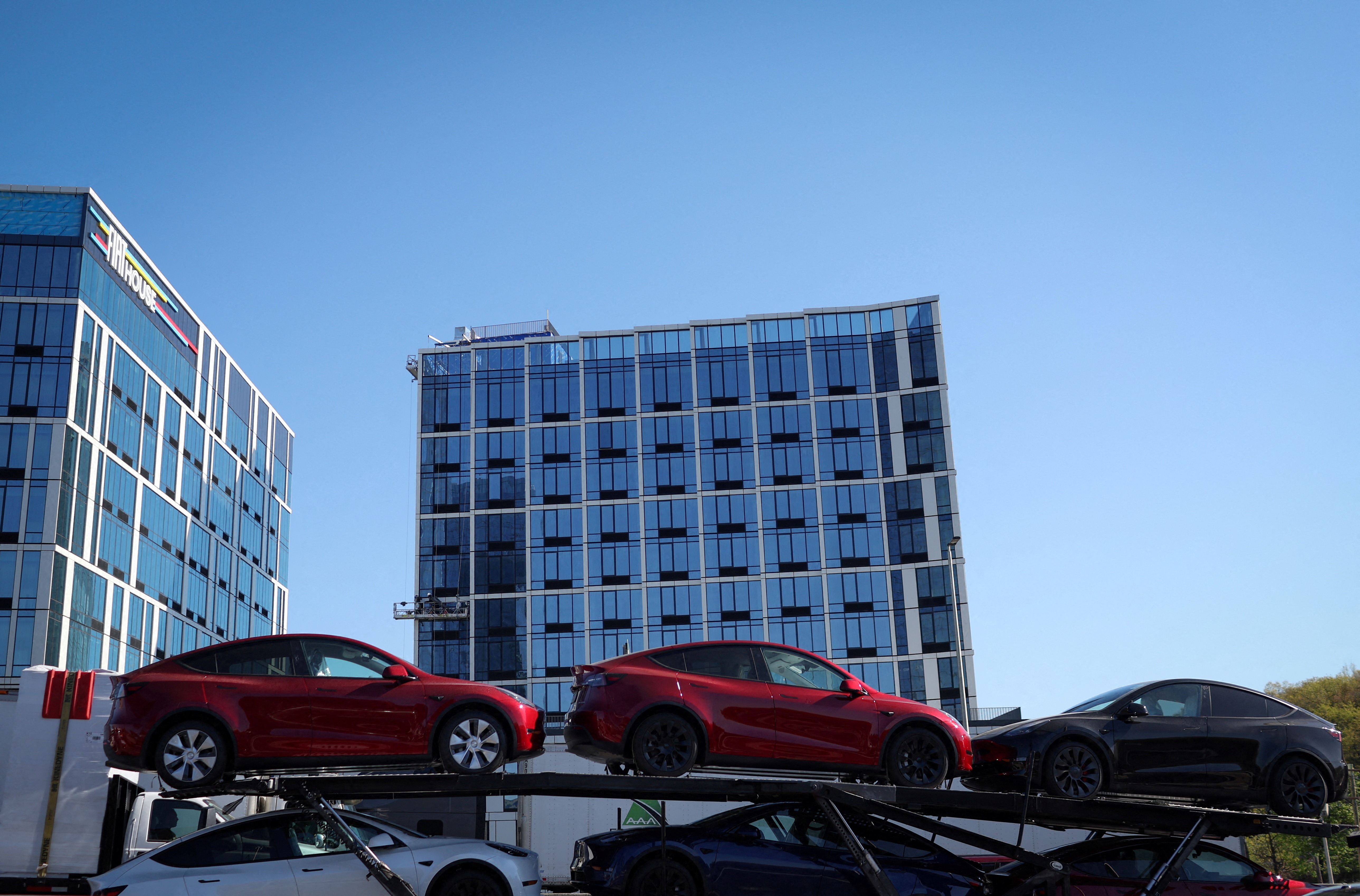 New Tesla vehicles are loaded on a car carrier in New York
