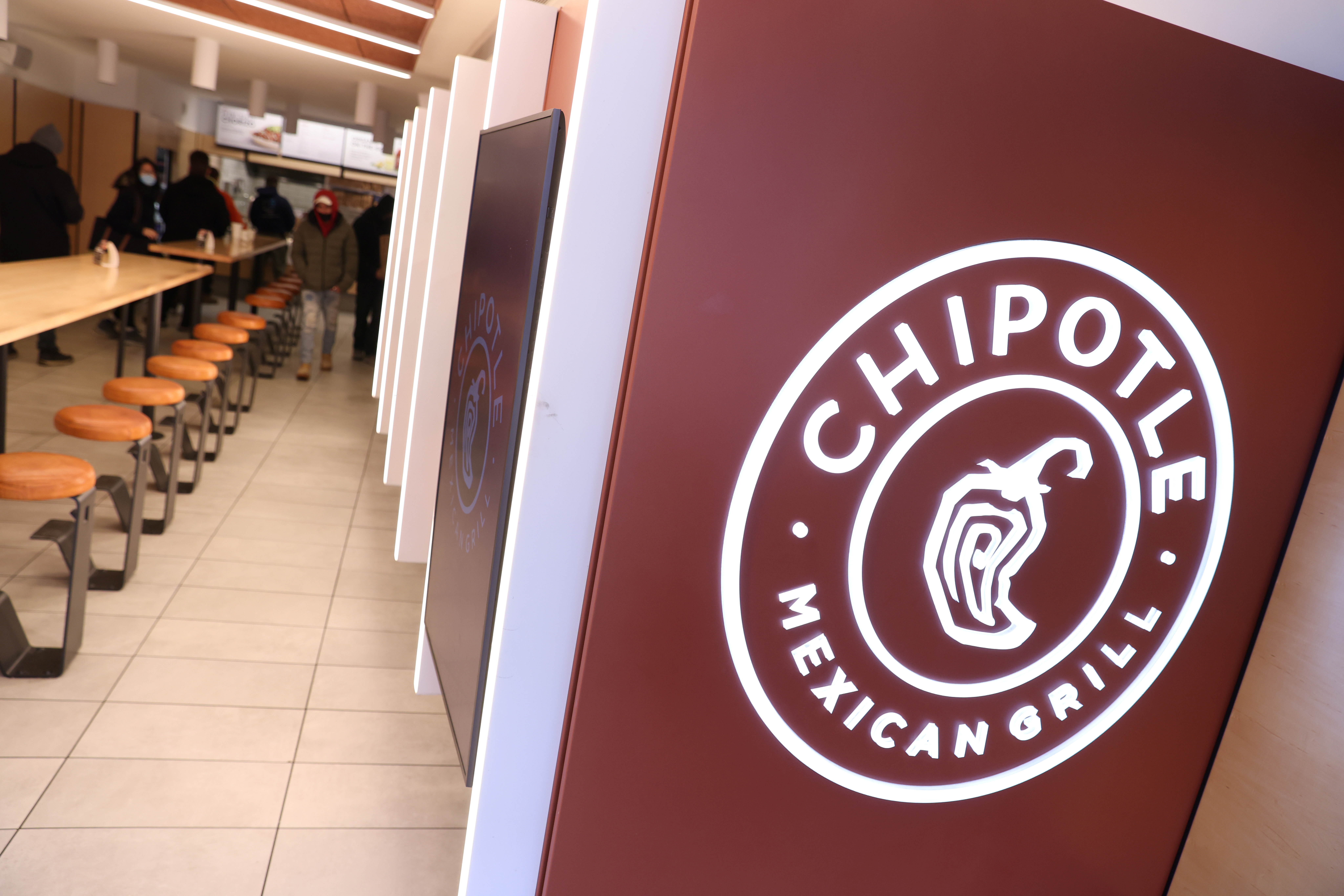 A signage is seen in a Chipotle outlet in Manhattan, New York City