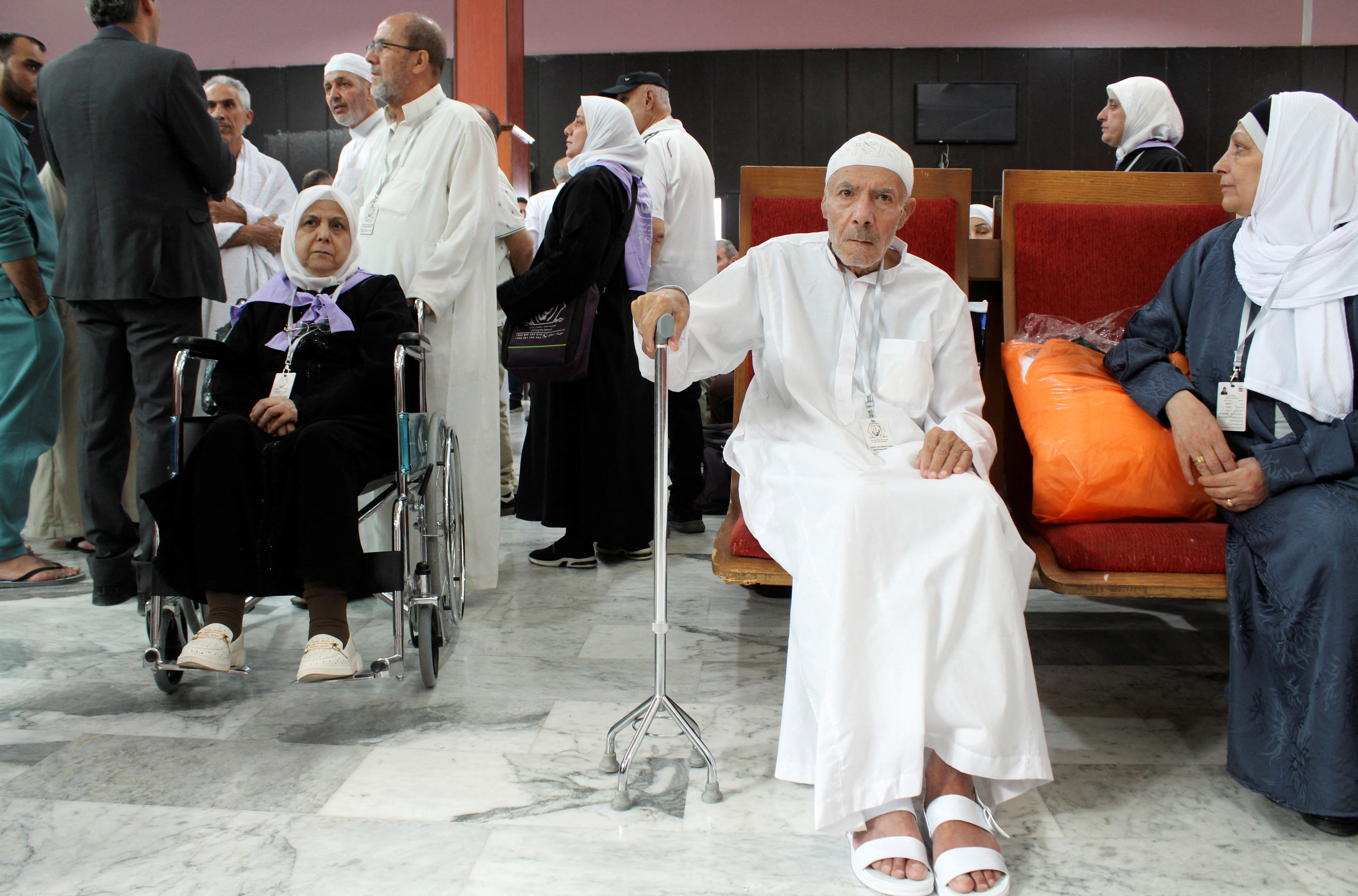 Syrian pilgrims wait to board a flight to Saudi Arabia at Damascus airport