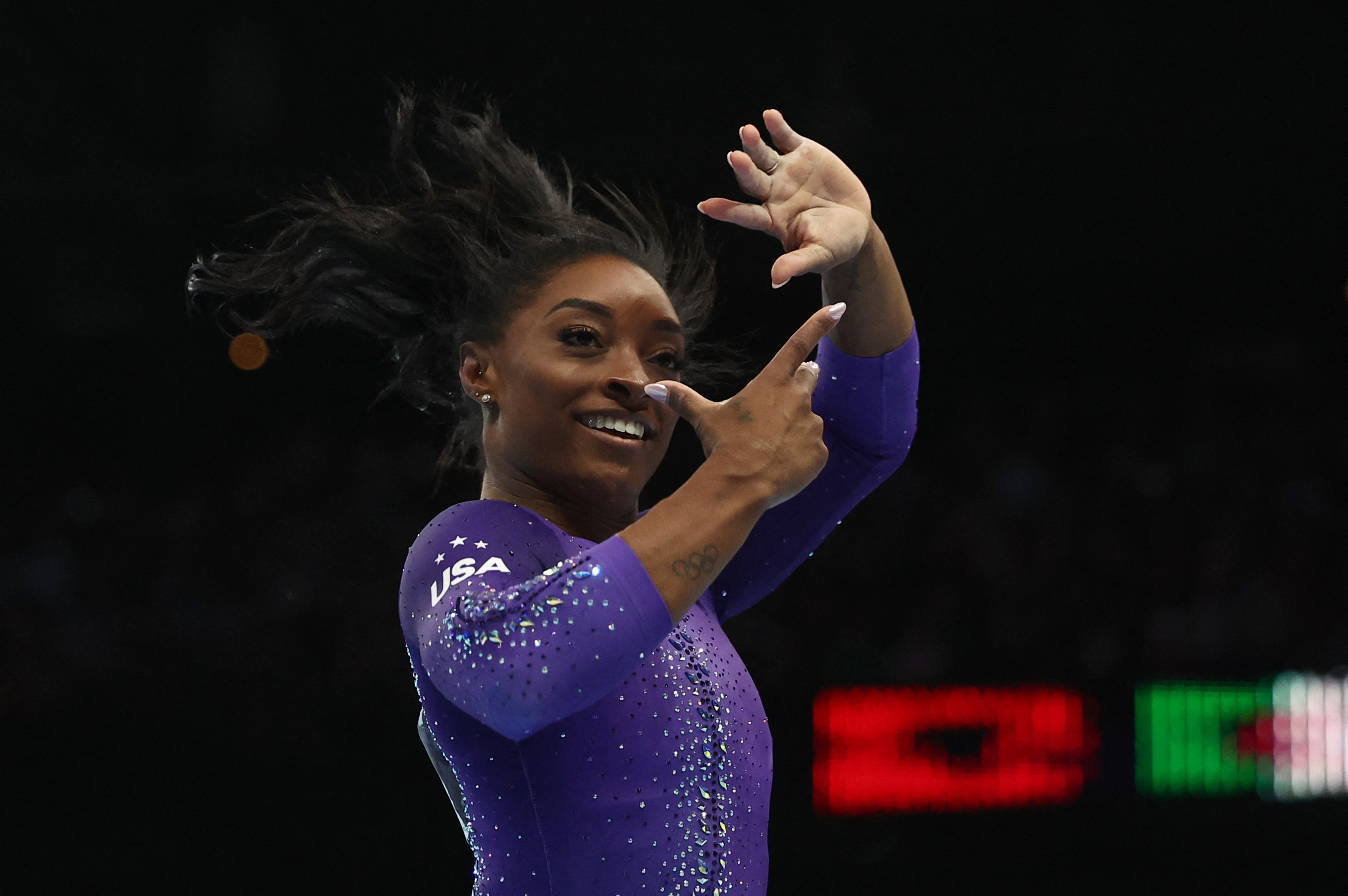 Simone Biles and Jake Jarman enjoy golden day at world