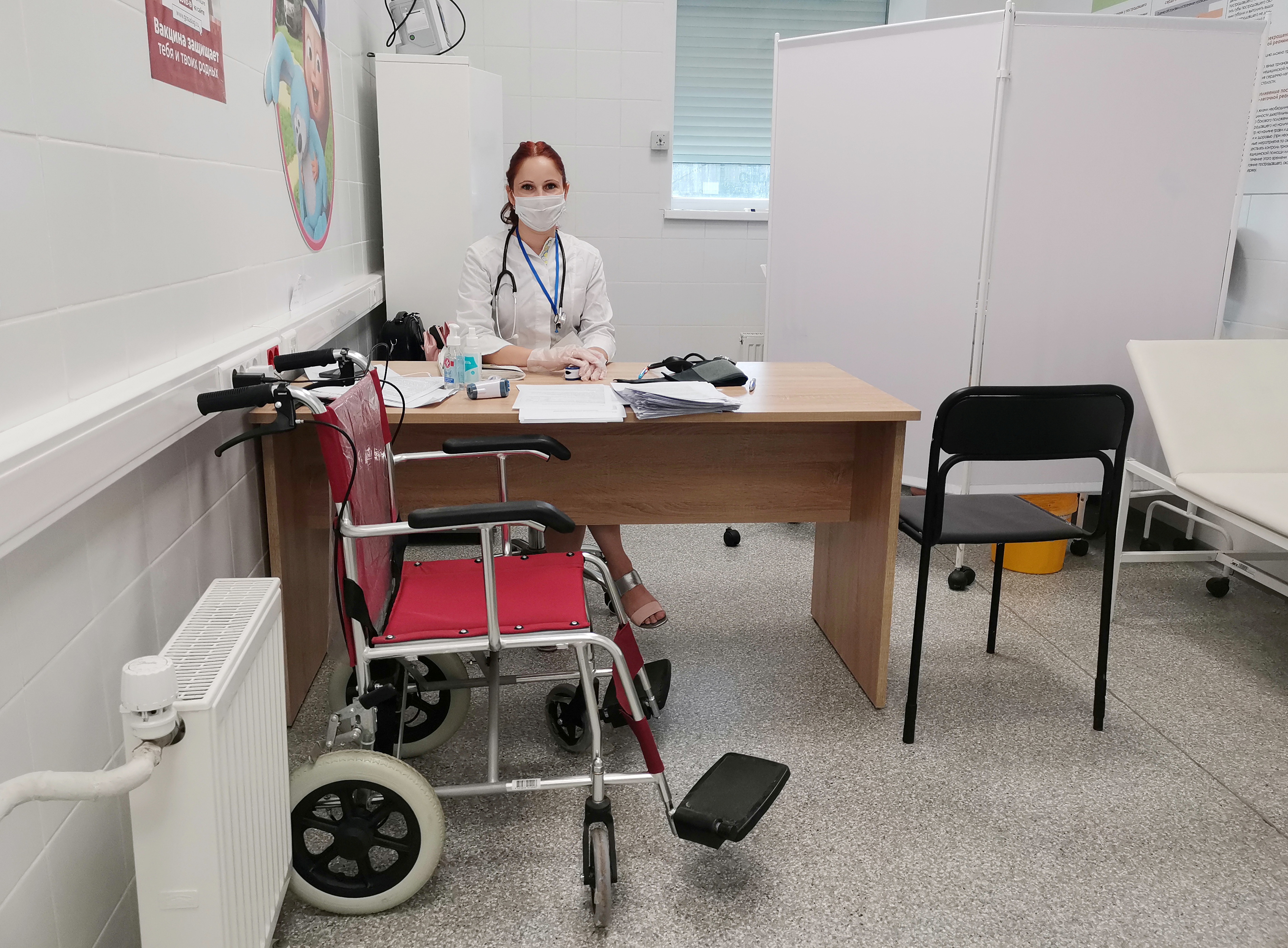 A medical specialist waits for recipients of COVID-19 vaccine in Belgorod